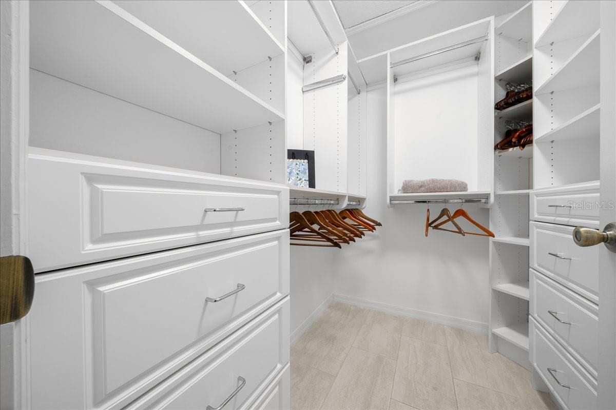 Primary Walk-in Closet w/ Custom Built Shelving - VILLAGES OF SUMTER, THE VILLAGES