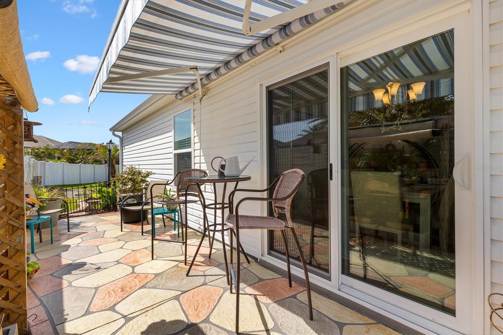 Private Patio and electric retractable awning with wind censor, just outside of the dining area. - 1773 BLACKWELL LN, THE VILLAGES