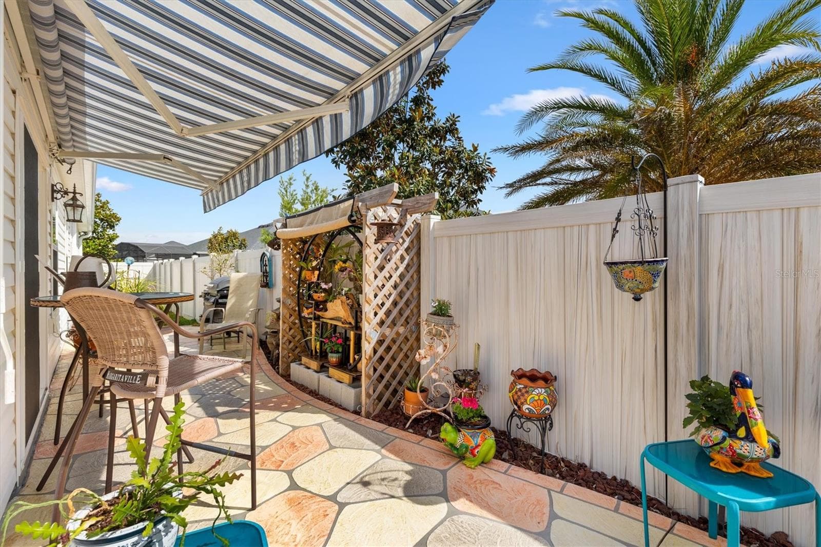 private patio and electric retractable awning with wind censor - 1773 BLACKWELL LN, THE VILLAGES