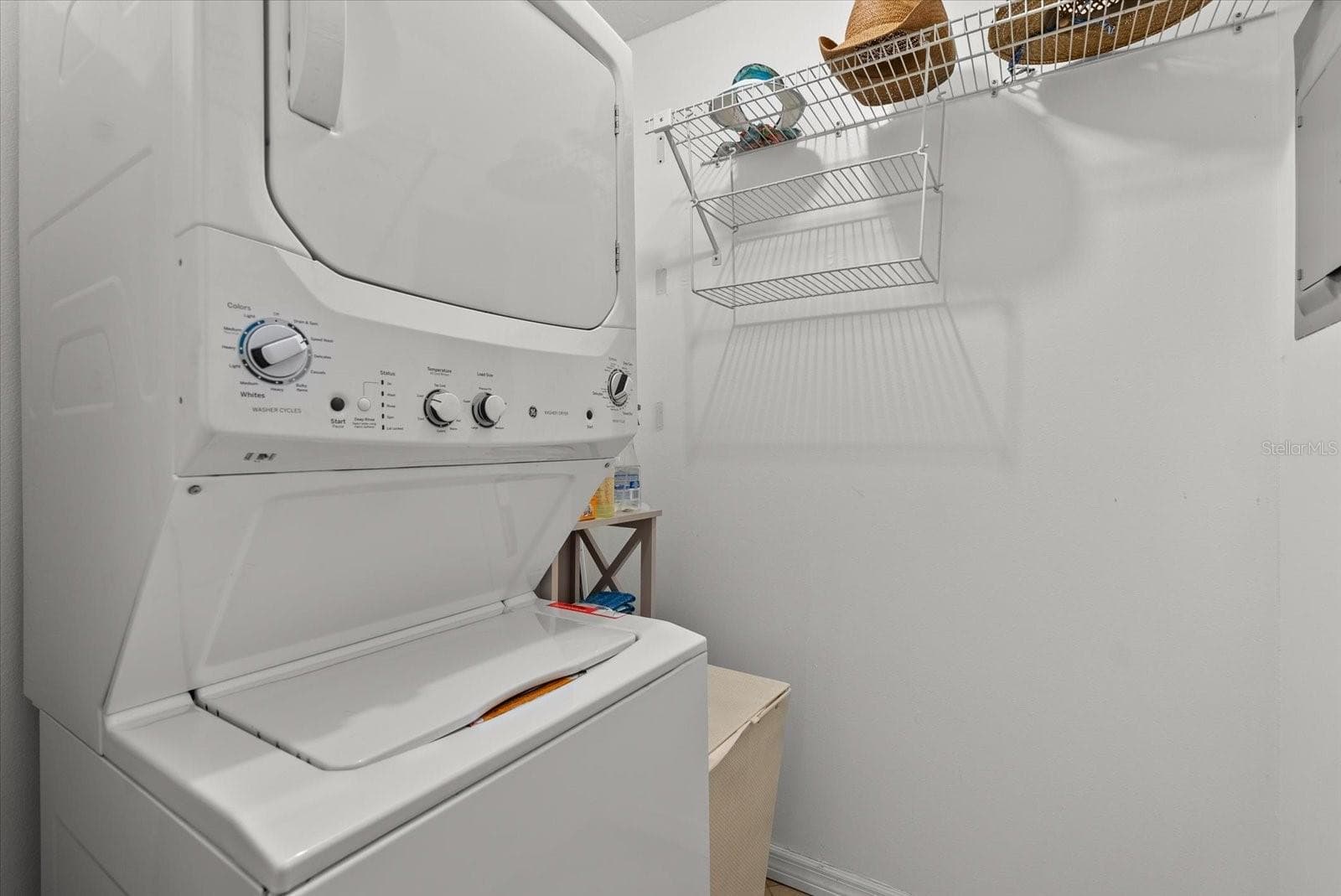 Indoor laundry room with a new stacked washer & dryer. - 2723 60TH AVENUE DR W #2723, BRADENTON