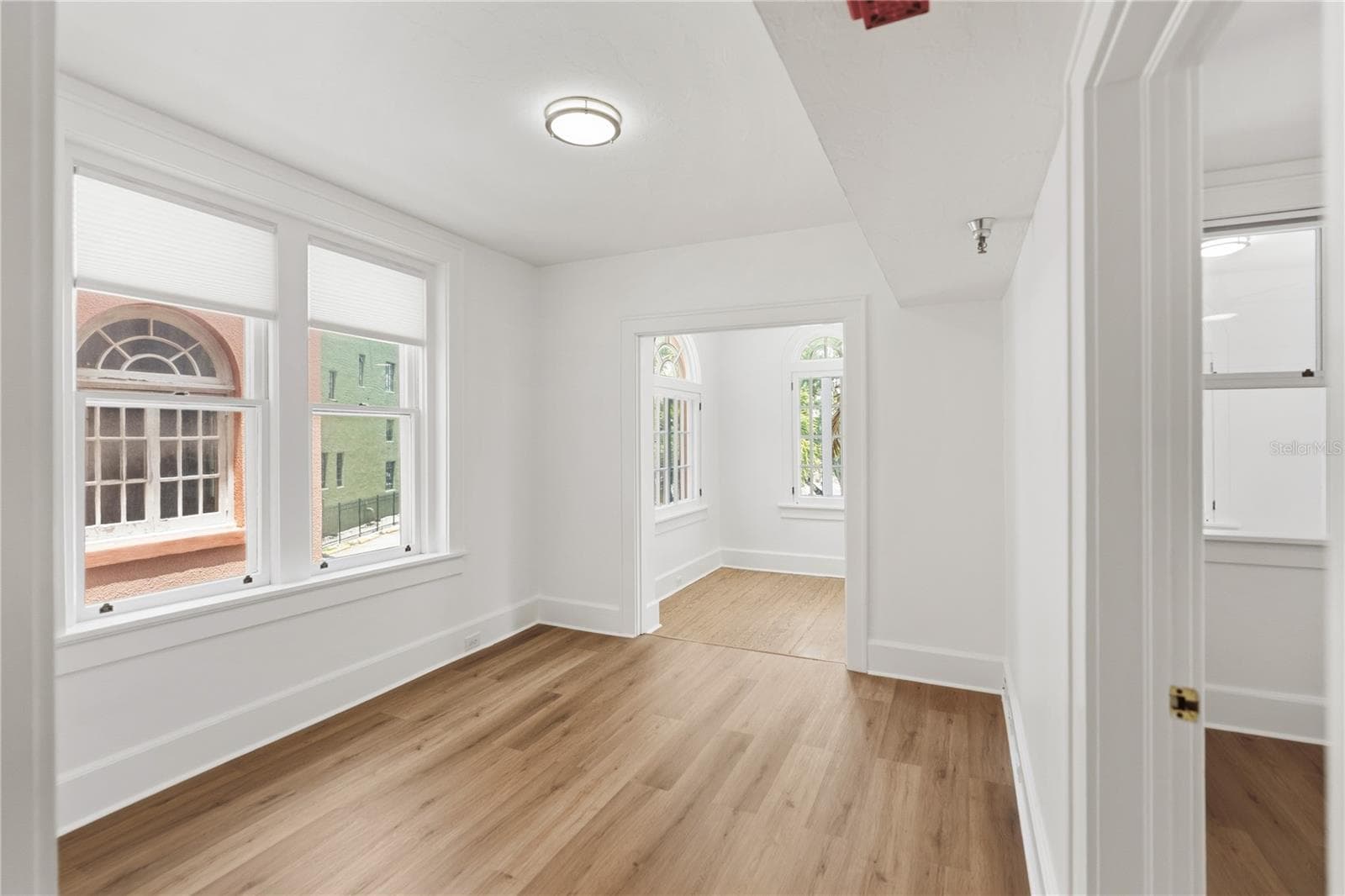 View into living room and bedroom - 1221 N PALM AVE #202, SARASOTA