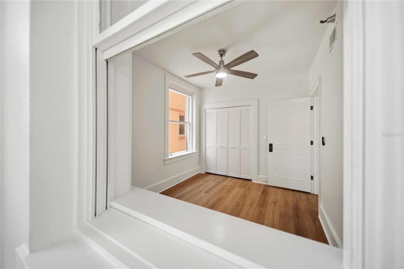 View into bedroom from sunroom - 1221 N PALM AVE #202, SARASOTA