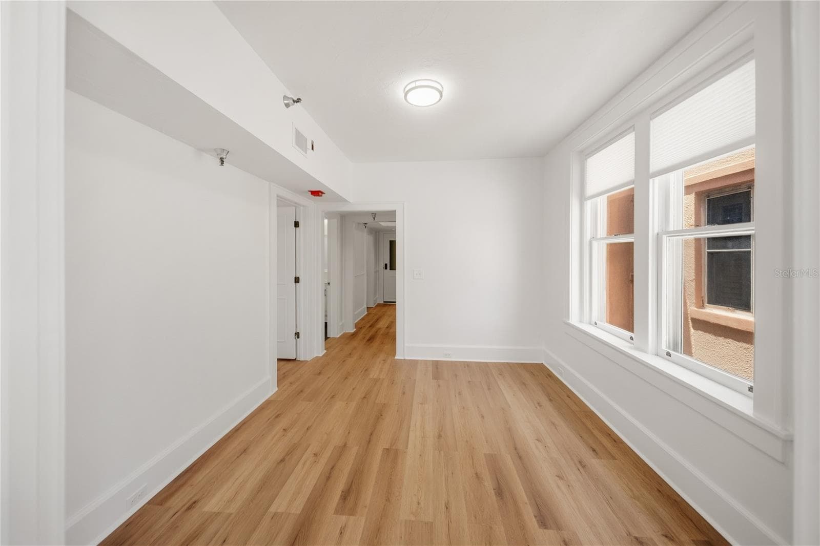 View into living room from sunroom - 1221 N PALM AVE #202, SARASOTA