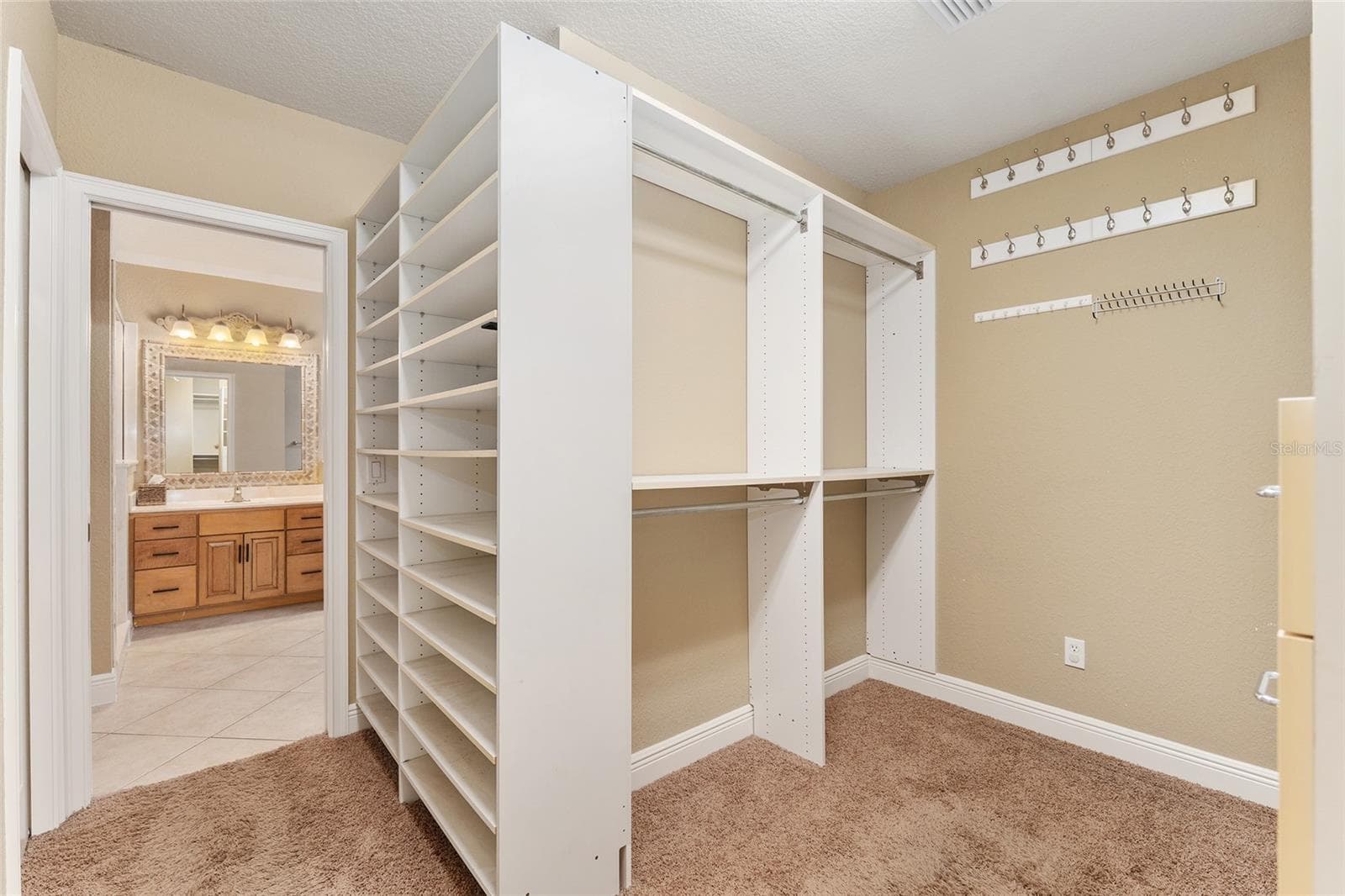 Primary bedroom closet his and shoe rack - 29 SE OCALE WAY, SUMMERFIELD