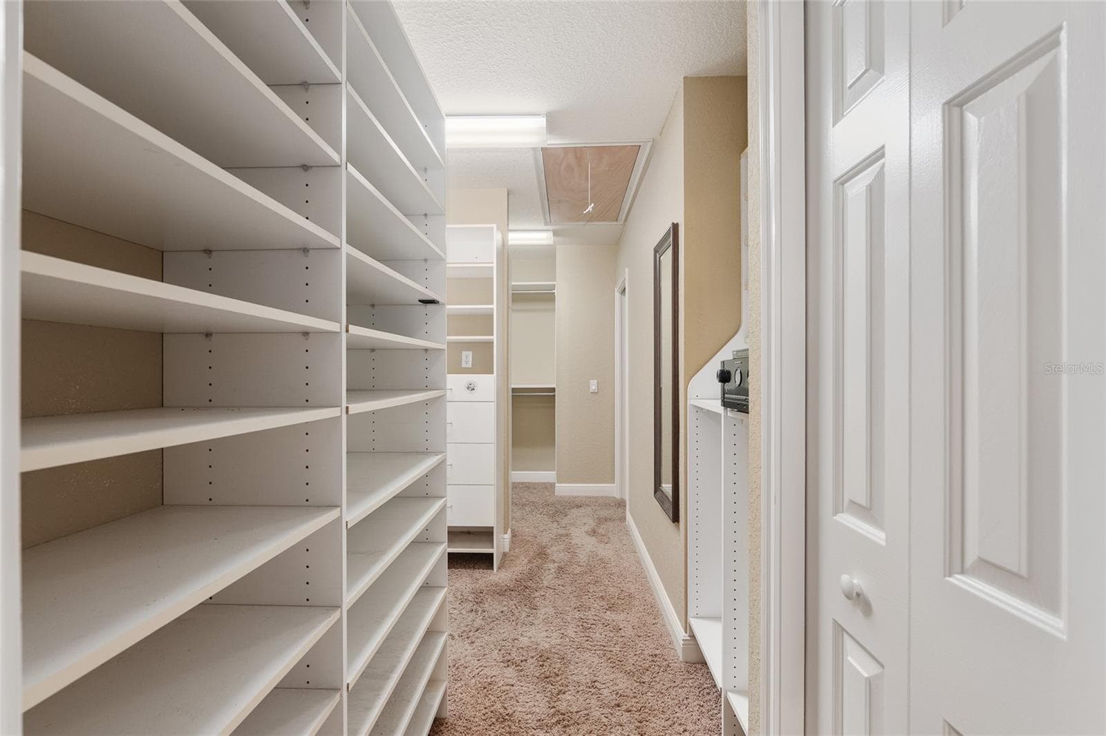 Shoe rack and his and her closets with pull down stairs to decked attic - 29 SE OCALE WAY, SUMMERFIELD