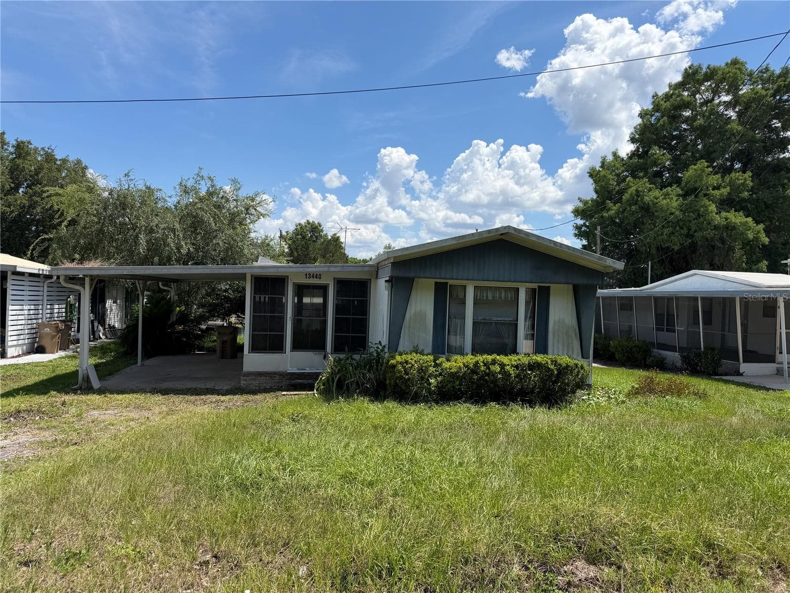 Front of the house from road - 13440 PALM DR #7, ASTATULA