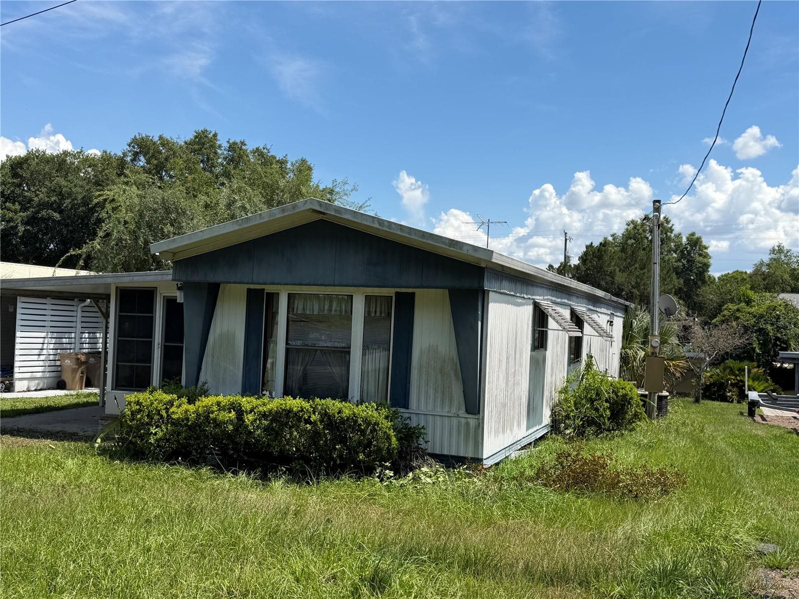 View from the east - 13440 PALM DR #7, ASTATULA