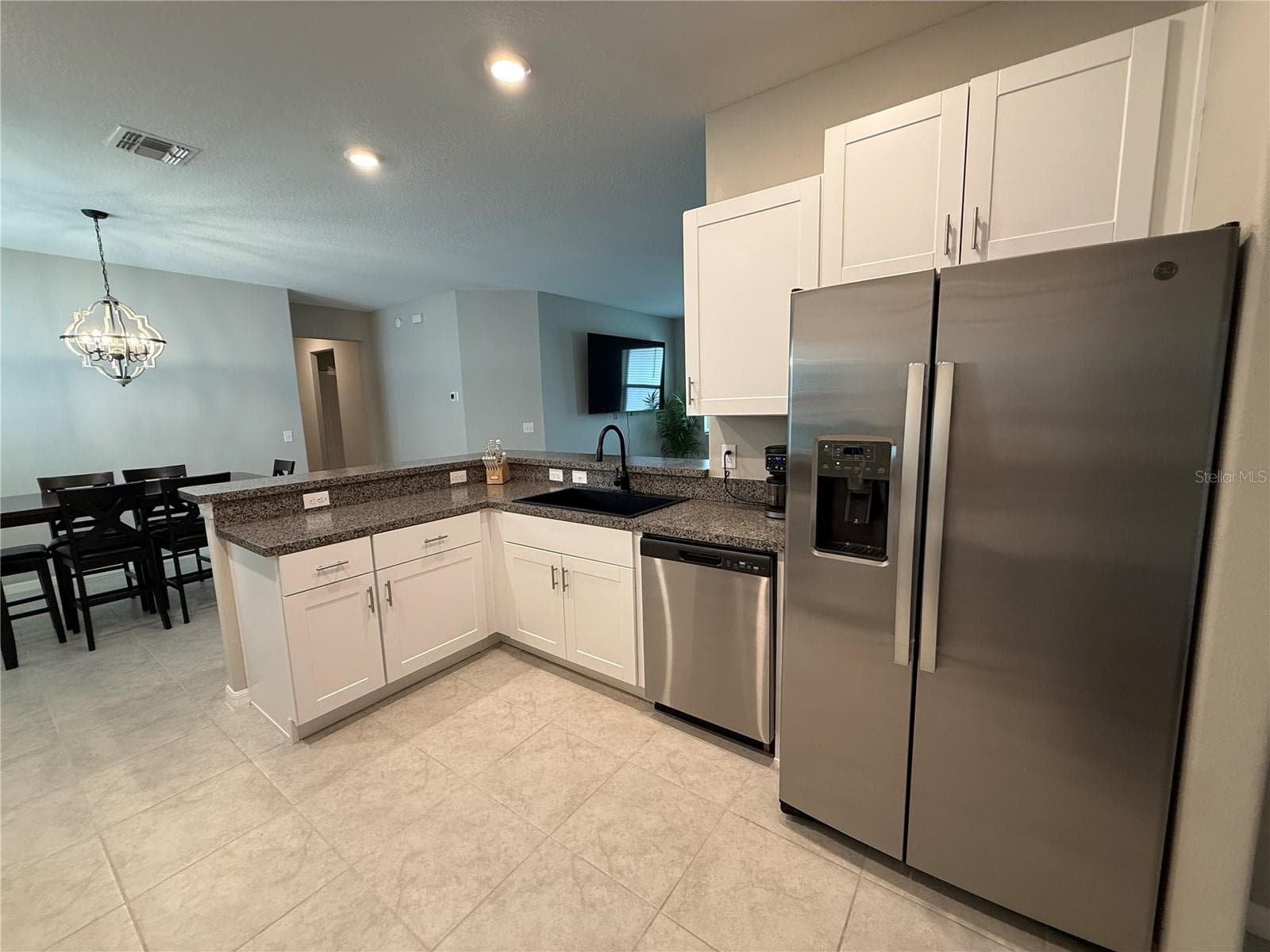 Plenty of wood cabinets - 9601 FLOURISH DR, LAND O LAKES