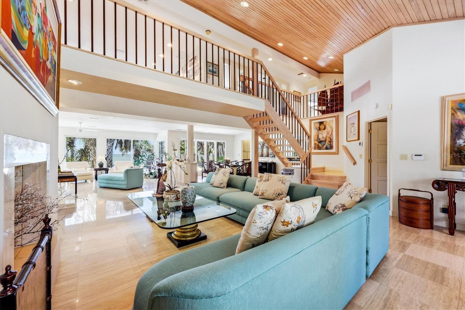 Spectacular travertine flooring compliments main living areas - 750 N MANASOTA KEY RD, ENGLEWOOD