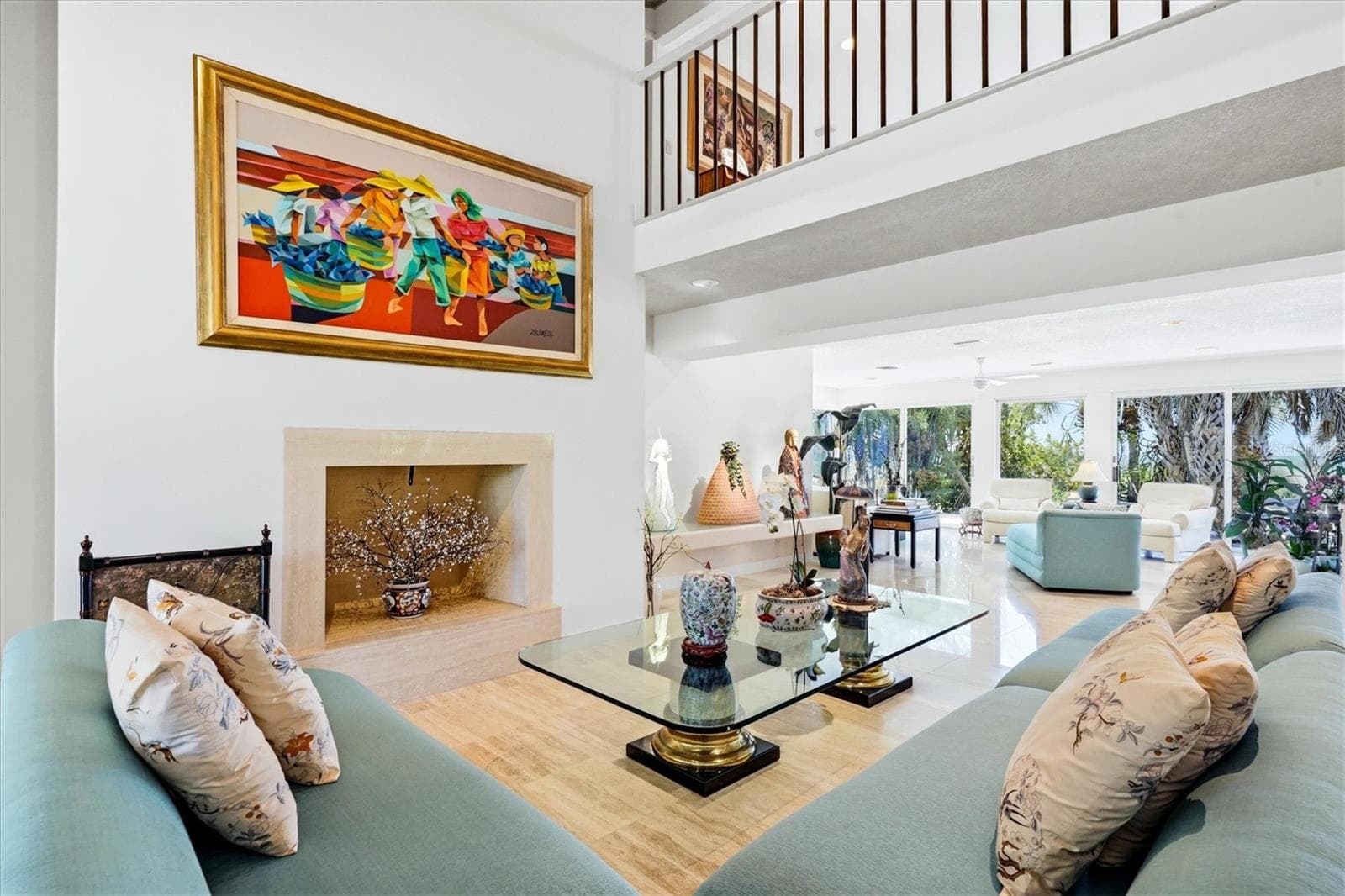 Living room features a wood burning fireplace - 750 N MANASOTA KEY RD, ENGLEWOOD