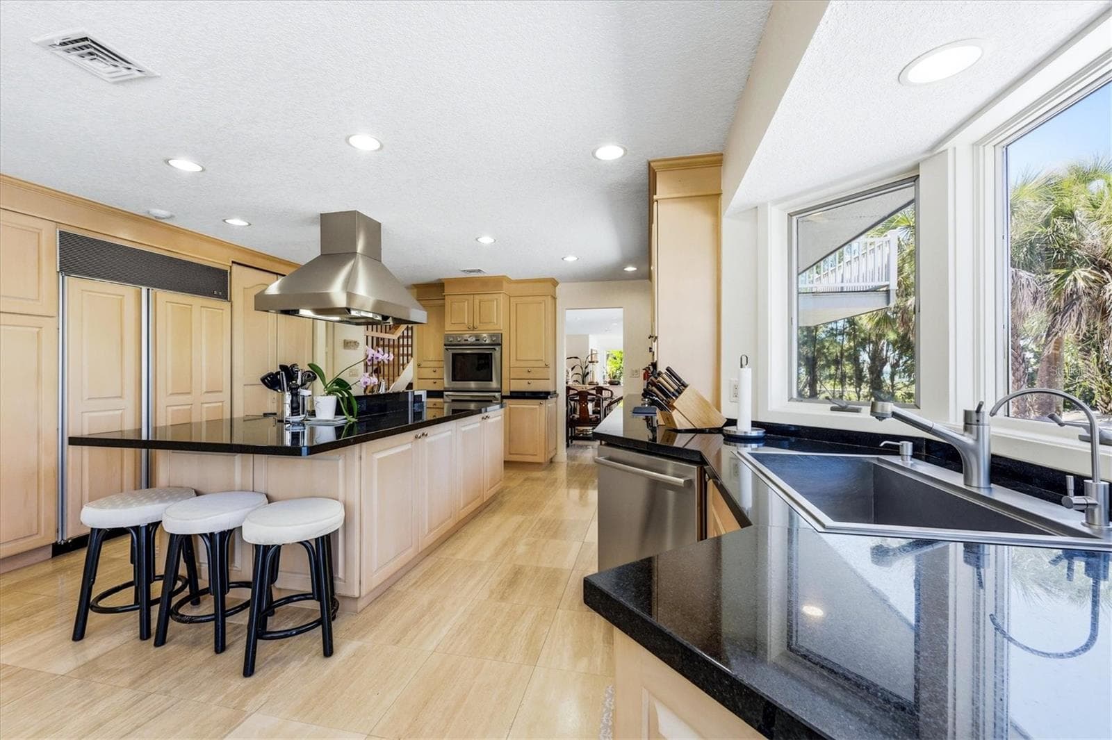 Kitchen features a gas range/hood, Subzero refrigerator & double convection ovens - 750 N MANASOTA KEY RD, ENGLEWOOD