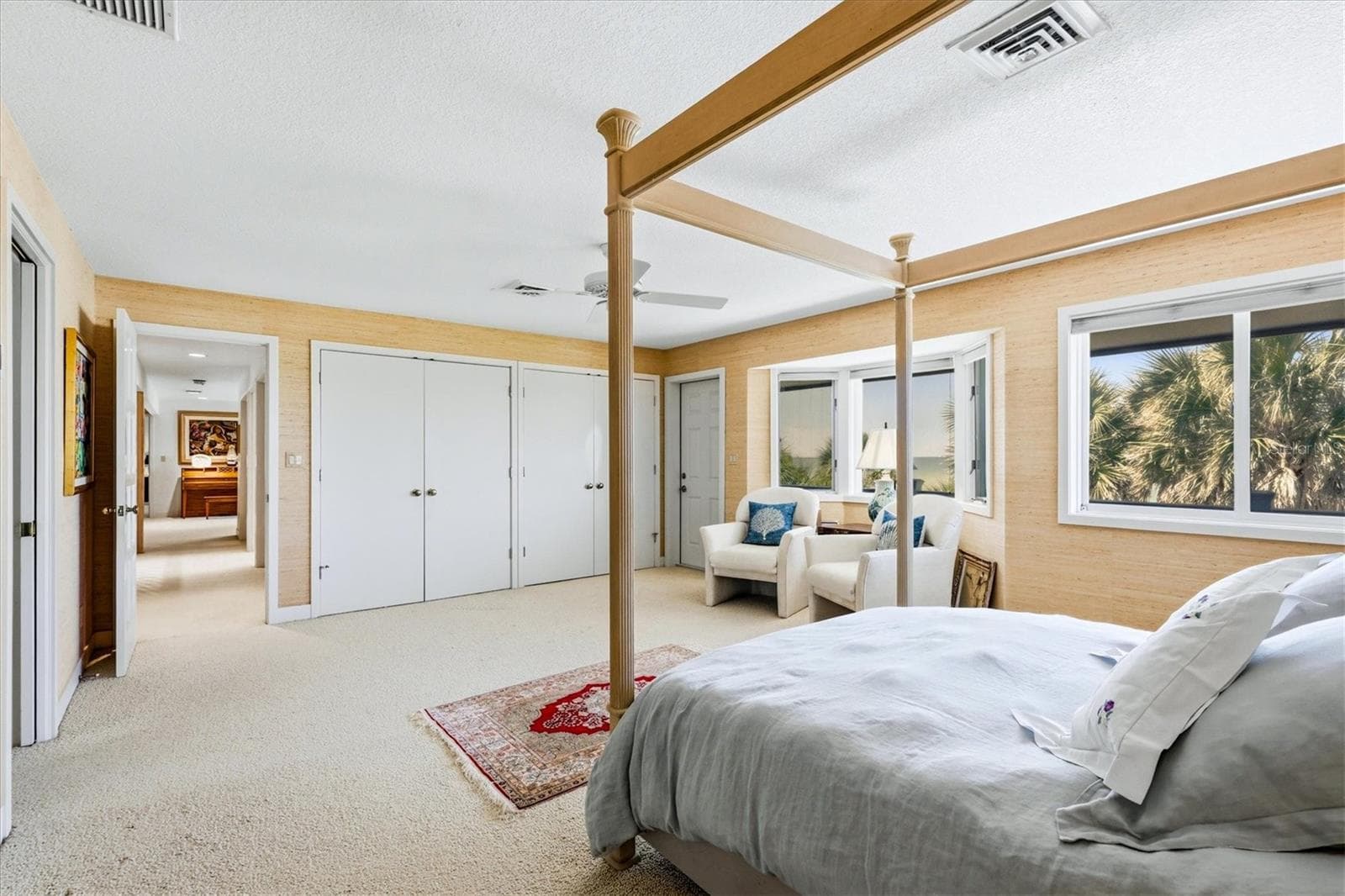 Primary Suite on upper level offers 2 closets plus a walk-in closet and direct access out to the balcony overlooking the Gulf - 750 N MANASOTA KEY RD, ENGLEWOOD