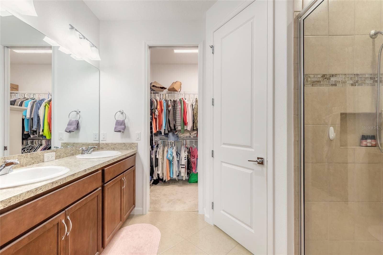 Primary ensuite bathroom with shower and large walk-in closet - 230 SAND BAR LN, DAYTONA BEACH