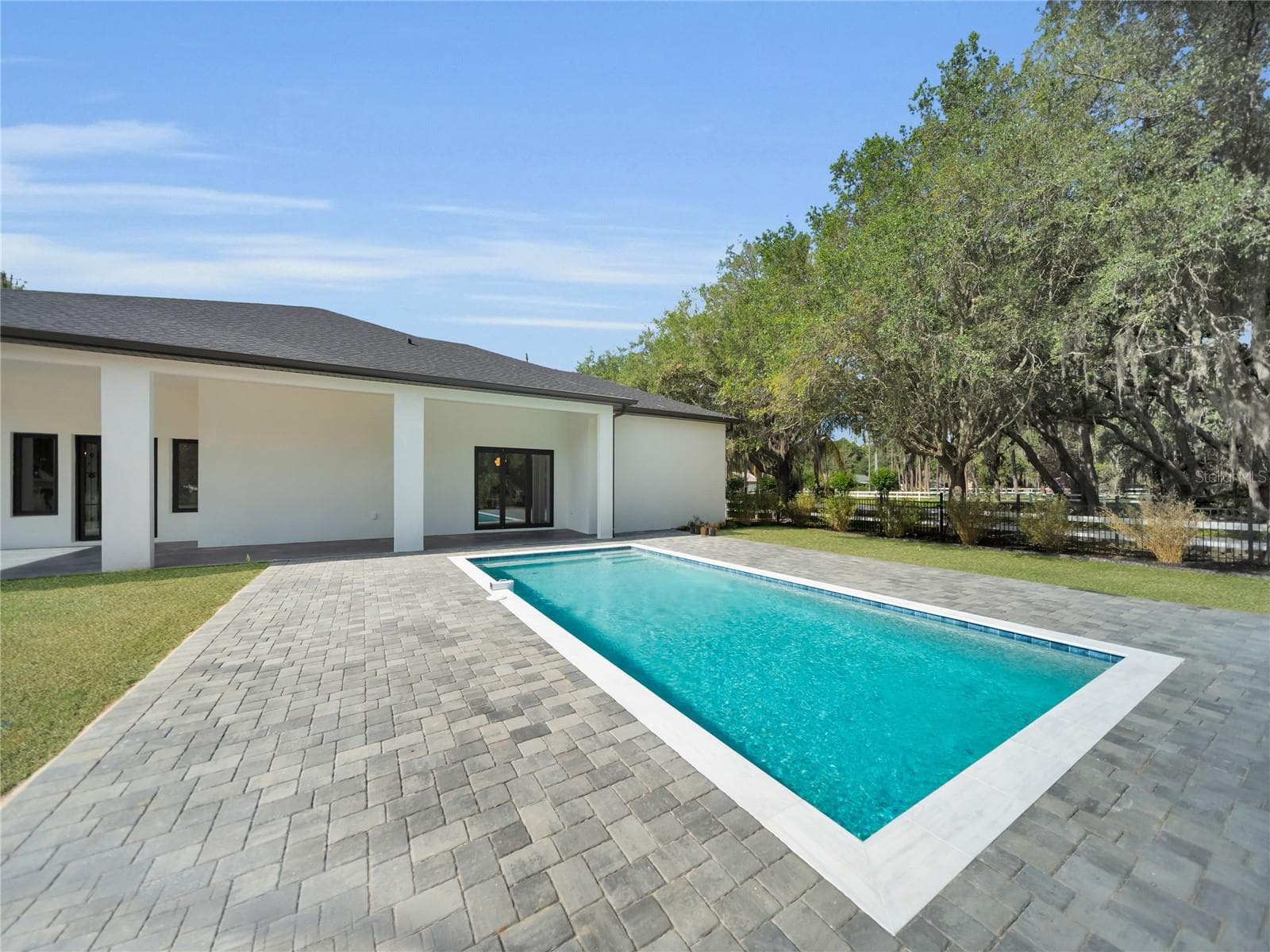 Pool with expansive paver deck - 11241 OSWALT RD, CLERMONT