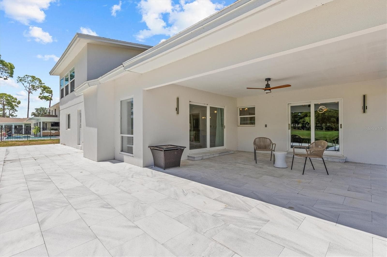 Outdoor lanai overlooking golf course - 13915 WHISPERWOOD DR, CLEARWATER