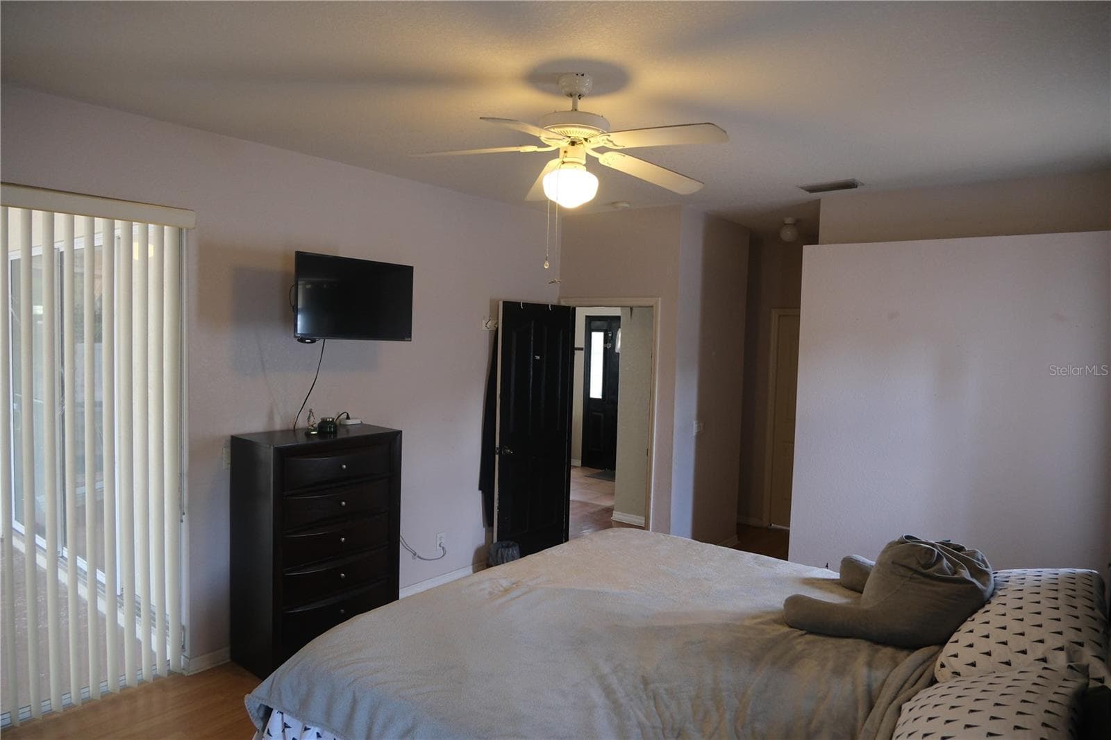 View of sliding door in primary bedroom leading to patio - 4491 CUTHBERT AVE, NORTH PORT