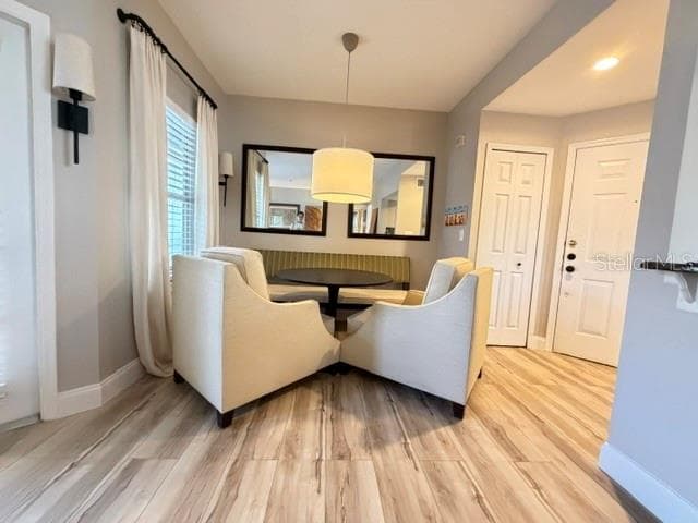 Dining area with lots of light from balcony window and brand new LV floors - 420 SUMMIT RIDGE PL #310, LONGWOOD