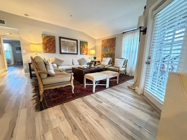 Living room with light from 2 sides- balcony door and window and brand new LV floors - 420 SUMMIT RIDGE PL #310, LONGWOOD