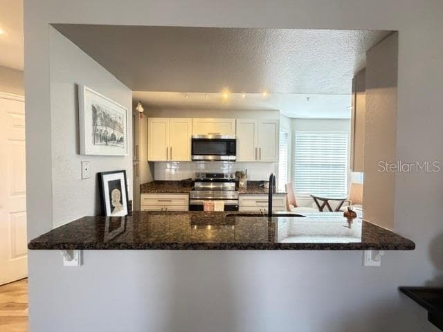 Kitchen bar and pass through - 420 SUMMIT RIDGE PL #310, LONGWOOD