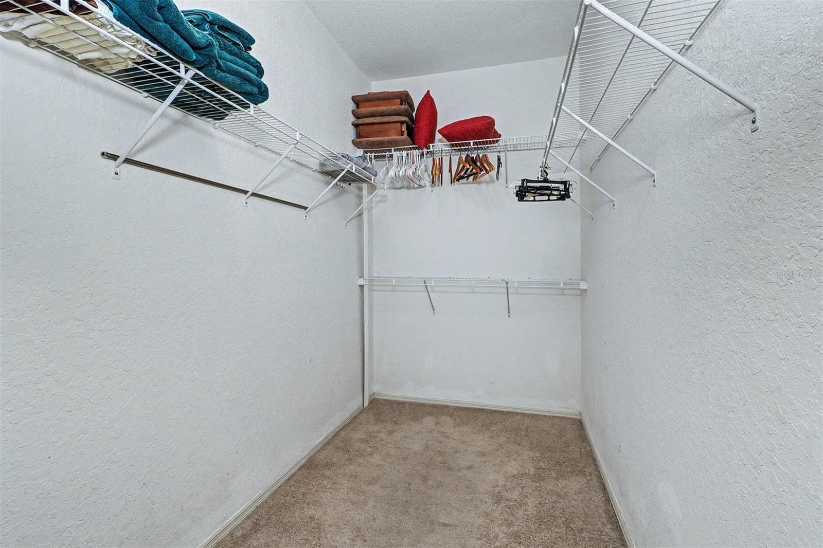 Primary bedroom walk in closet - 2746 VIA TIVOLI #110B, CLEARWATER