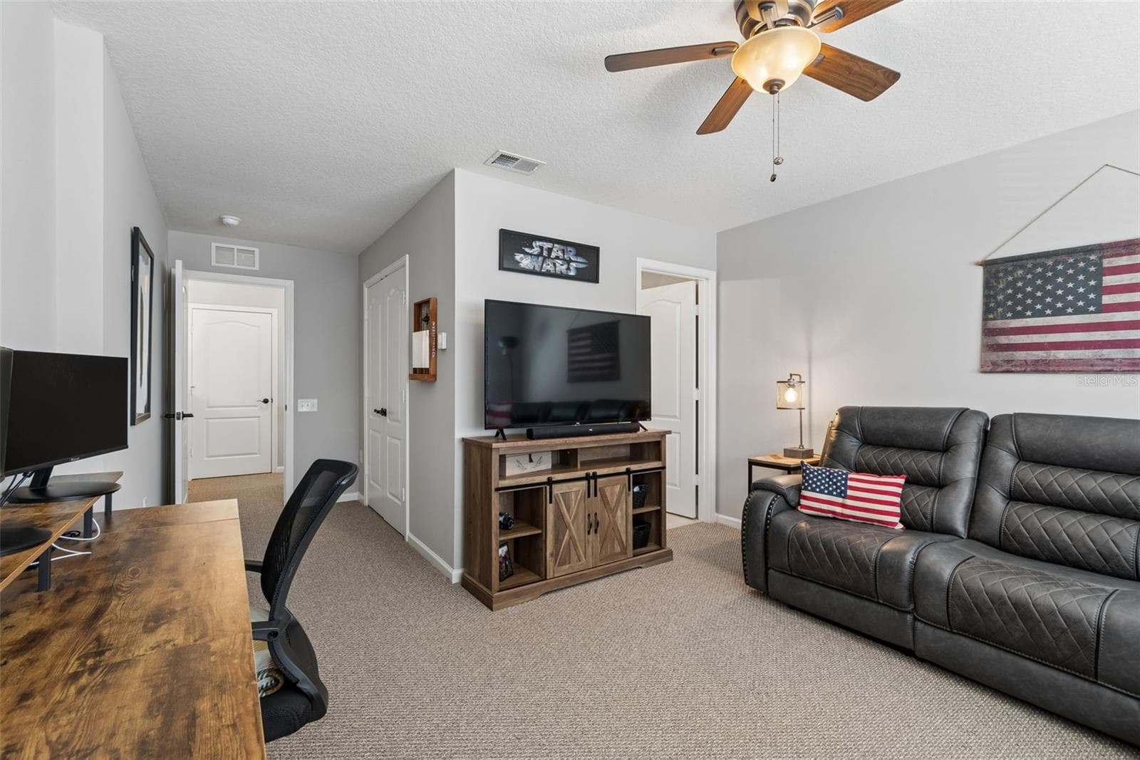 3rd bedroom being used as a bonus room/tv room - 5401 LOOKOUT PASS, WESLEY CHAPEL