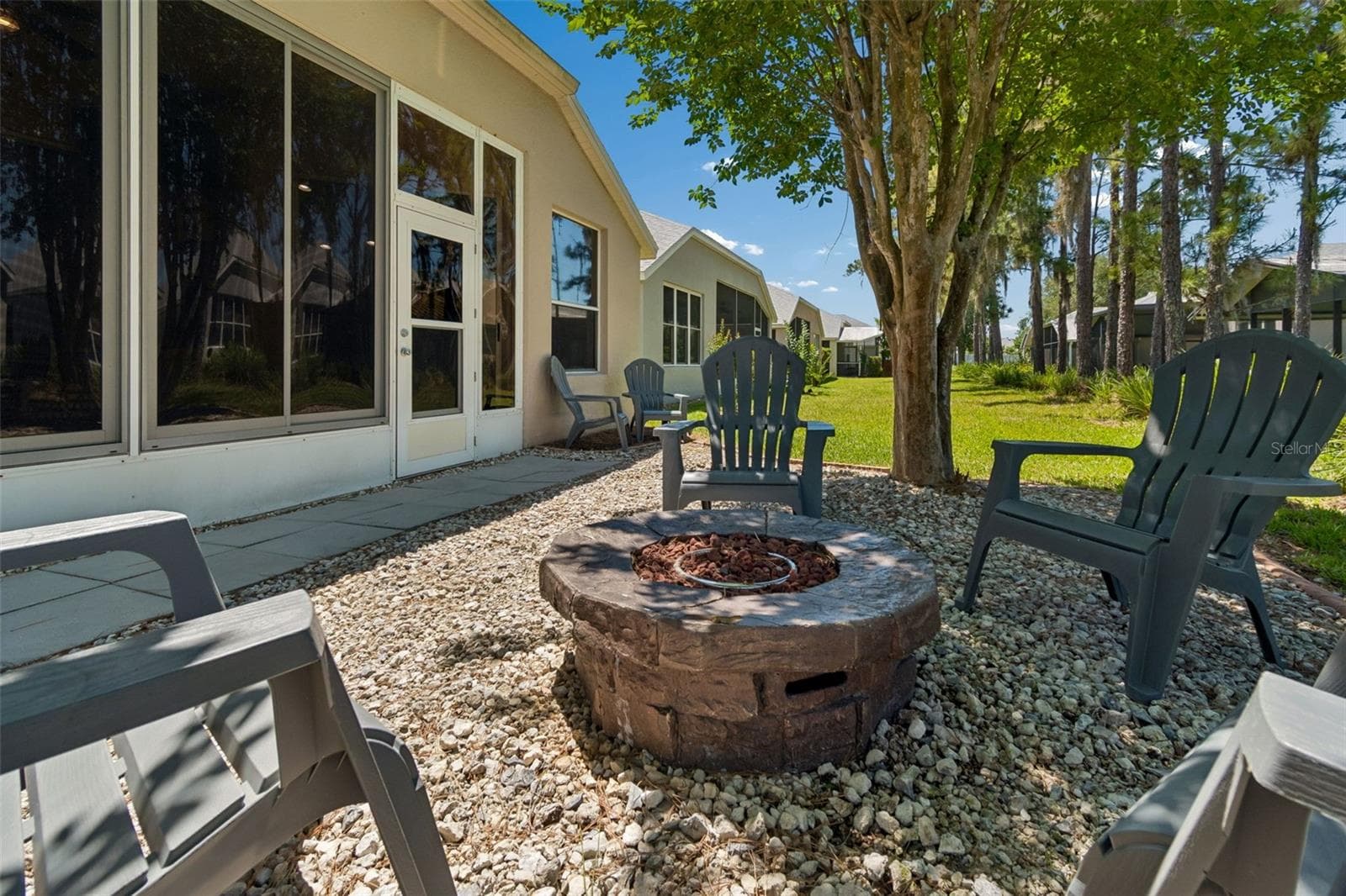 Fire pit in back yard - 5401 LOOKOUT PASS, WESLEY CHAPEL