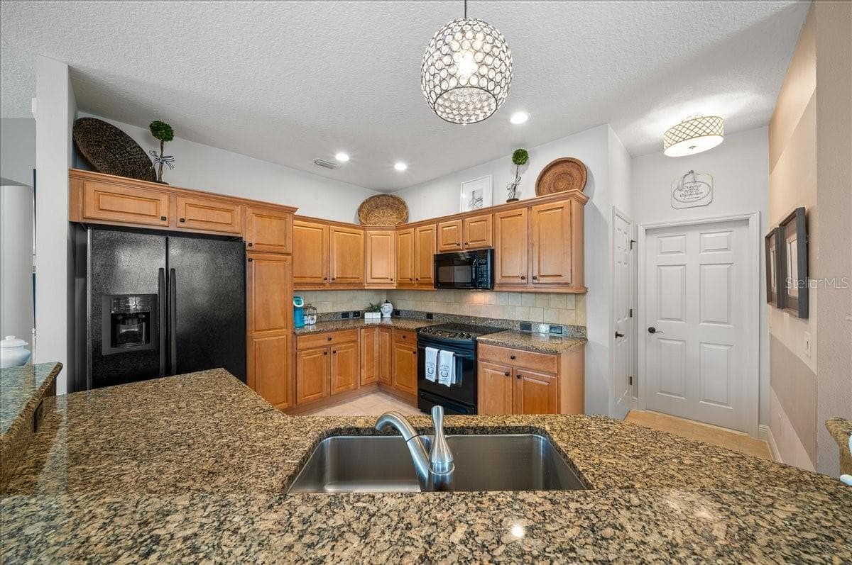 Kitchen Features Water-Fall Island w/ Granite Countertops - 1606 SNELLING AVE, THE VILLAGES