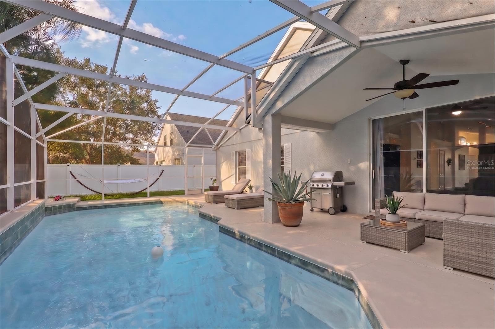 Pool deck and Lanai Outdoor living areaVirtually staged - 6847 BOUGANVILLEA CRESCENT DR, ORLANDO
