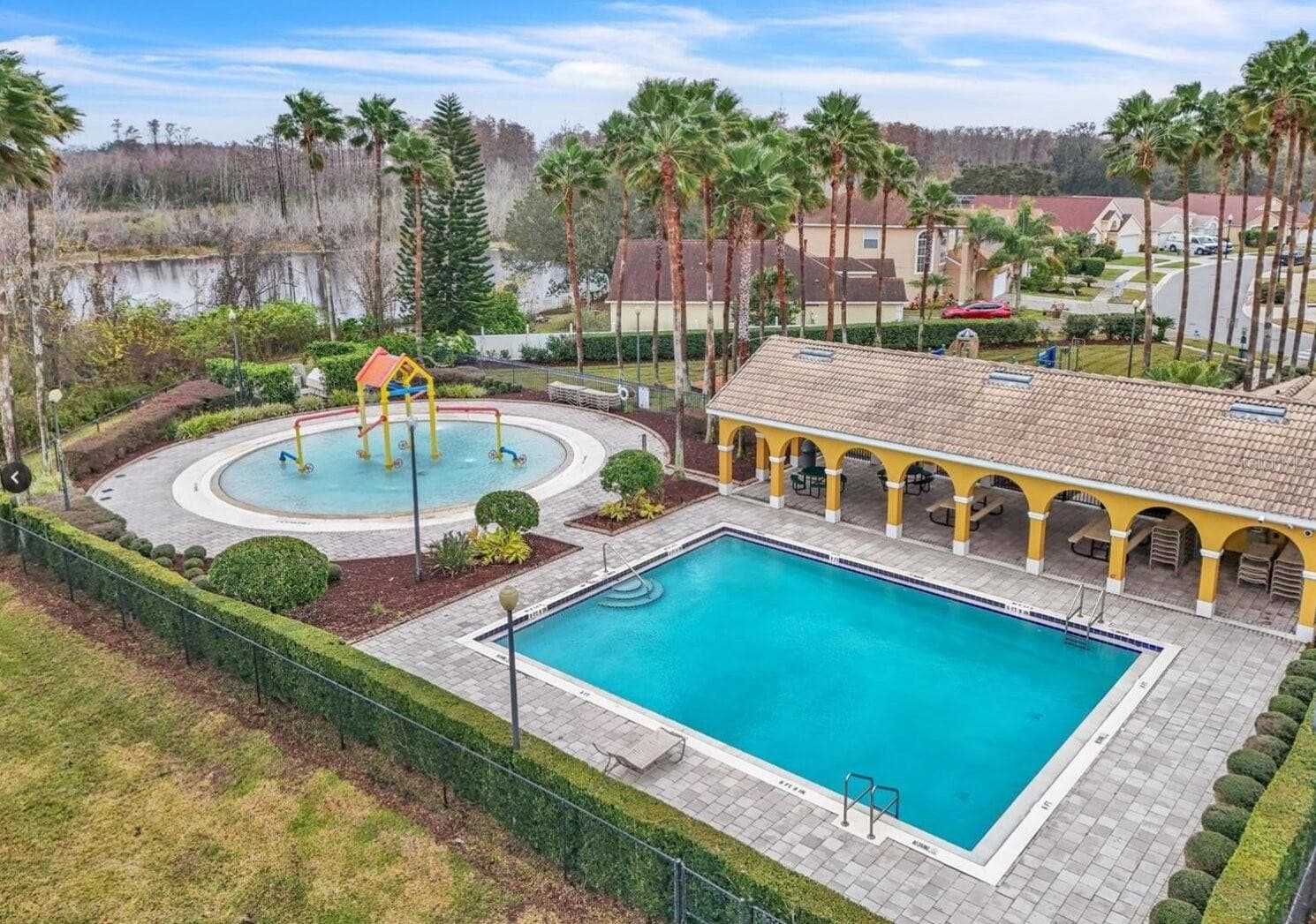 community pool and splash pad - 6847 BOUGANVILLEA CRESCENT DR, ORLANDO