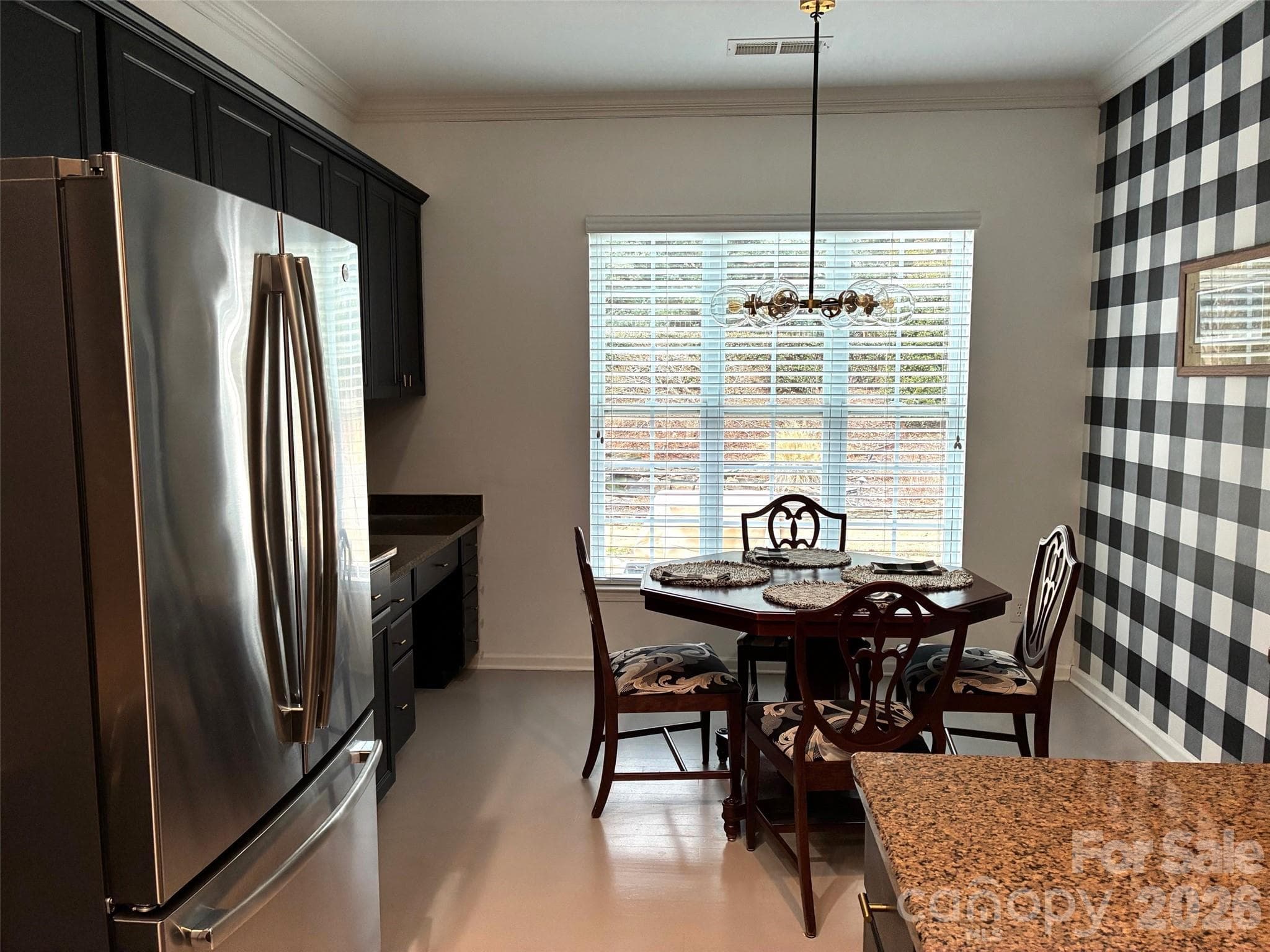 Informal dining overlooks patio and yard - 43041 Mimosa Court, Fort Mill