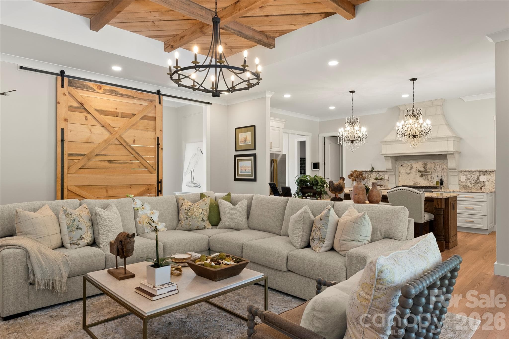 The great room features soaring ceilings, exposed beams, and seamless indoor-outdoor flow. - Horse Shoe