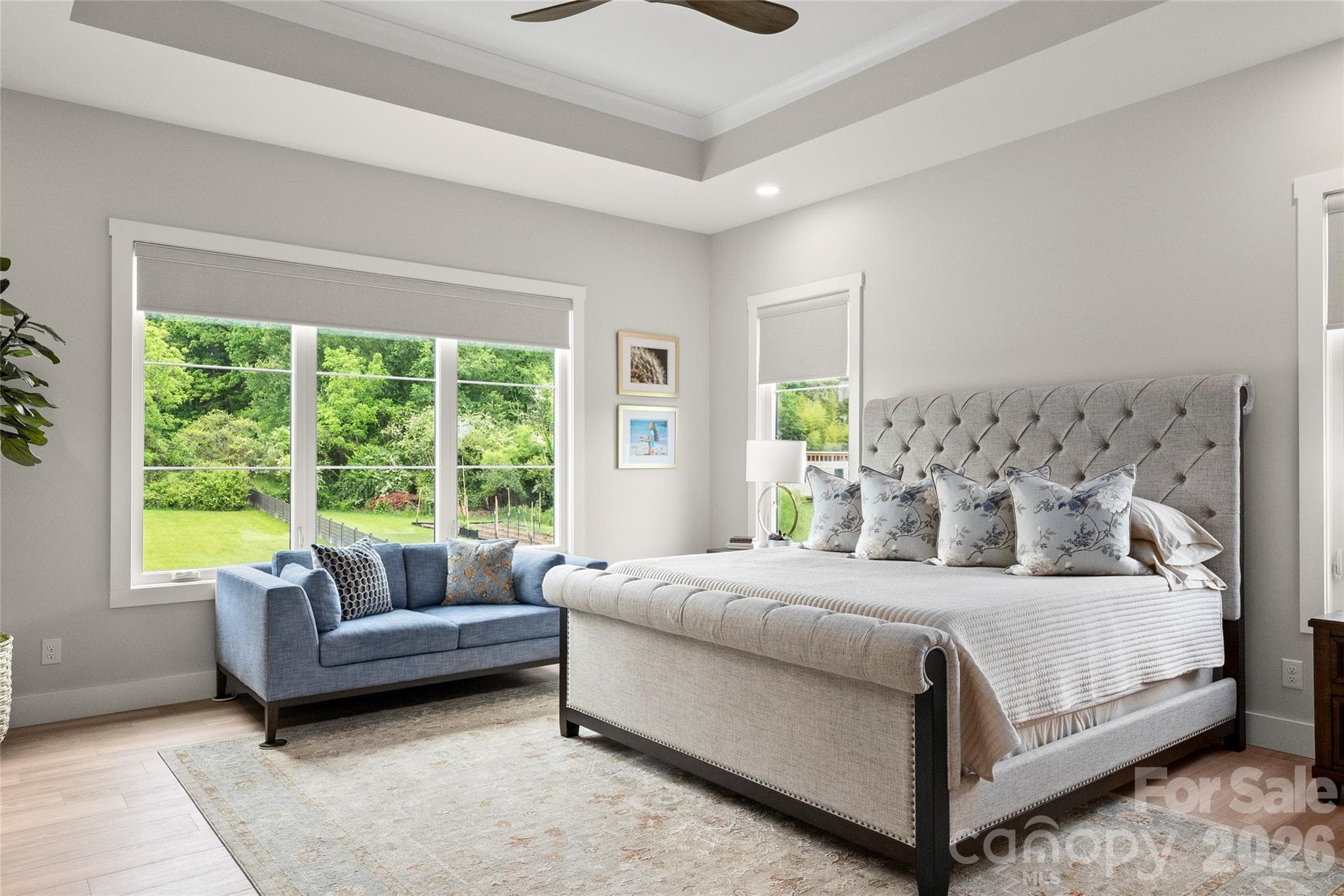 The primary suite offers a peaceful retreat with spa-inspired comfort and garden views. - Horse Shoe