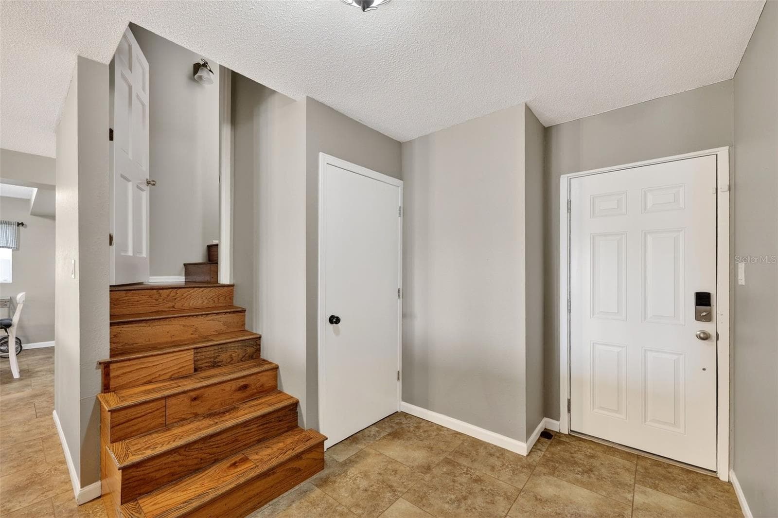 Stairs to first level. Door to right goes out side. middle door is storage. - 19801 GUNN HWY, ODESSA