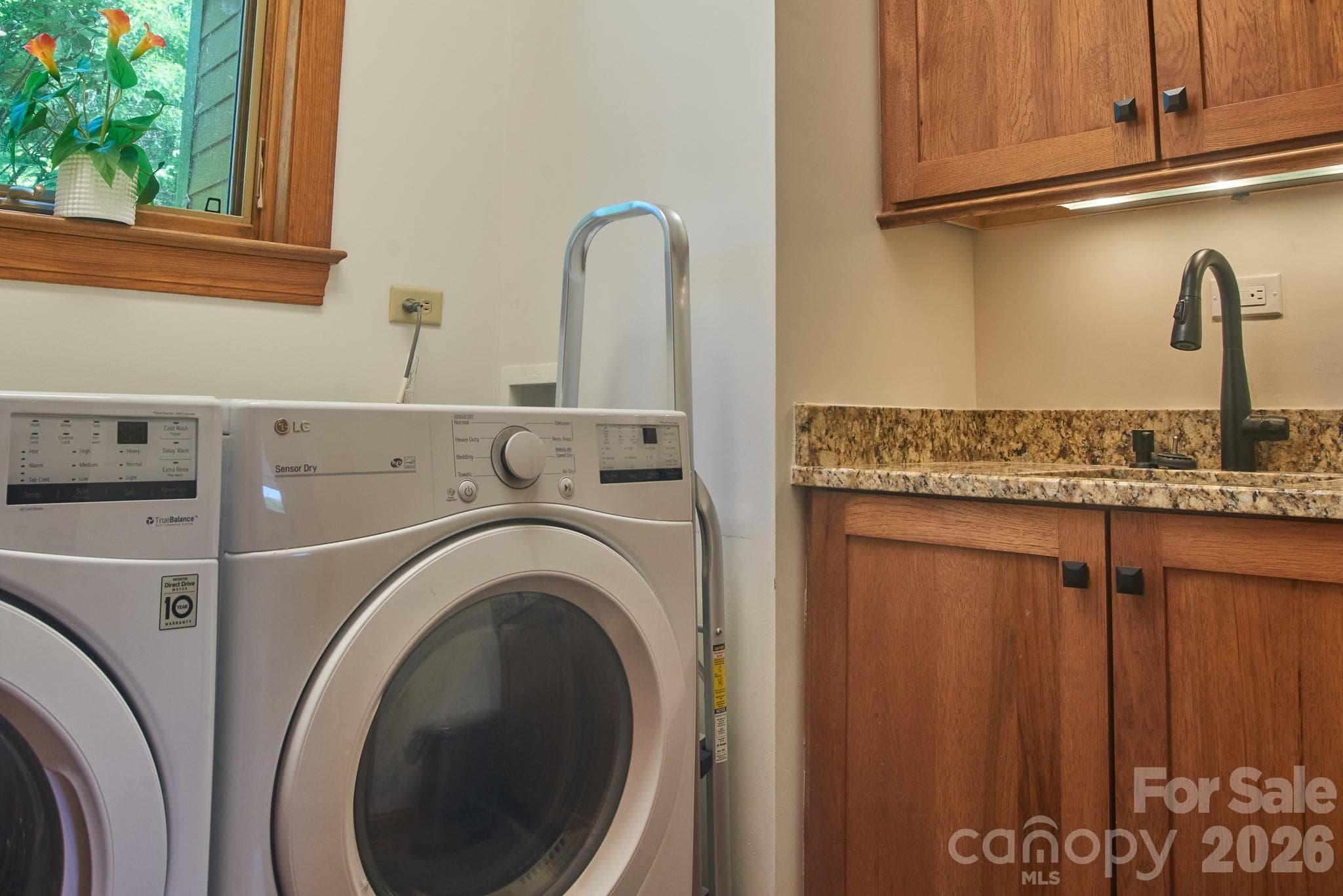 Main level - Laundry Room with vanity and sink - Burnsville