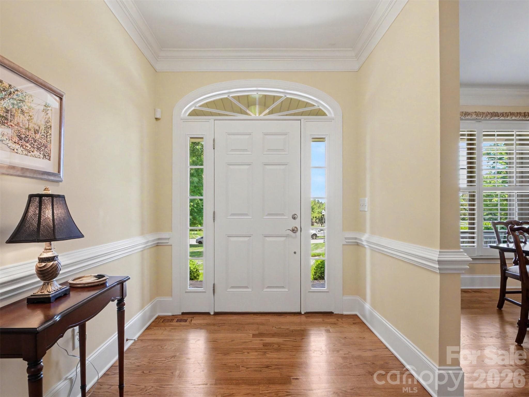 You enter into a wide foyer with thick molding and gleaming hardwood floors. - 1422 Stone Gate Drive, Shelby