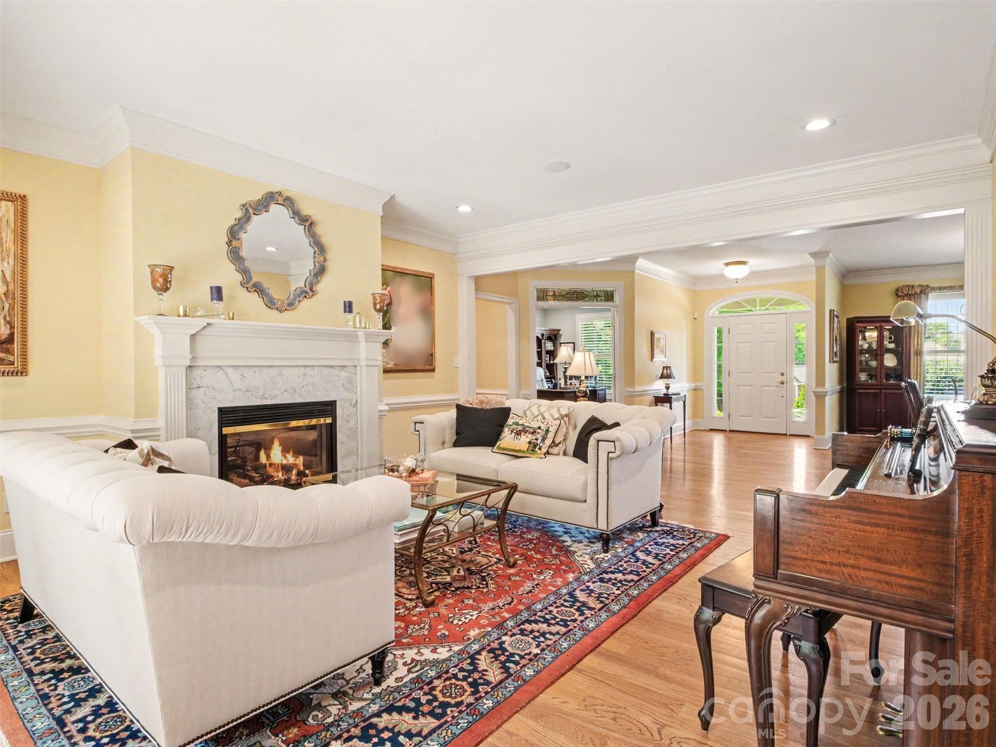 The living room has 9' ceilings and a gas fireplace that includes a remote and blower. - 1422 Stone Gate Drive, Shelby