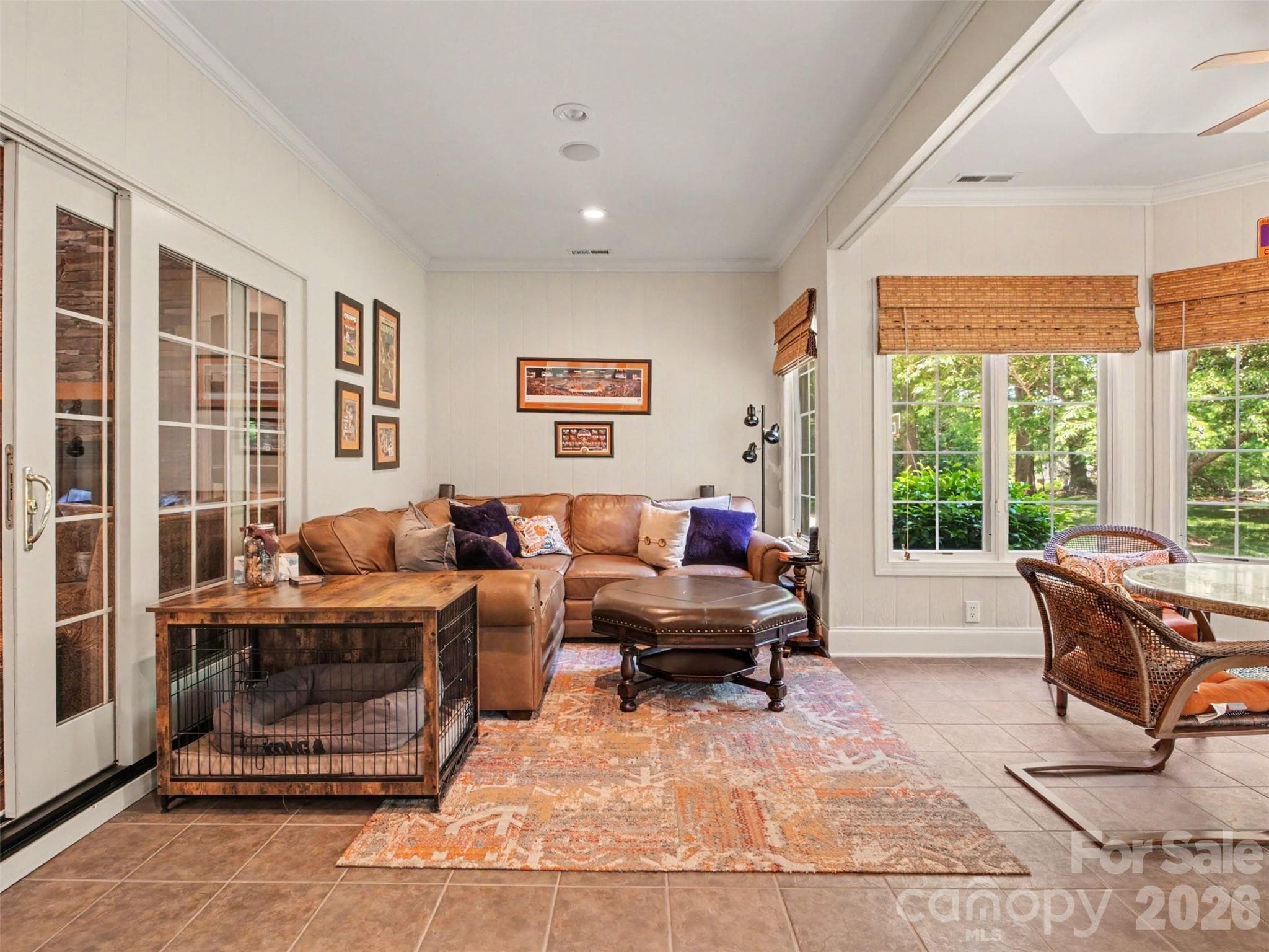 Sliding doors in the family room access the bright and airy sunroom...the perfect setting for morning coffee, reading, or casual gathering year-round. - 1422 Stone Gate Drive, Shelby