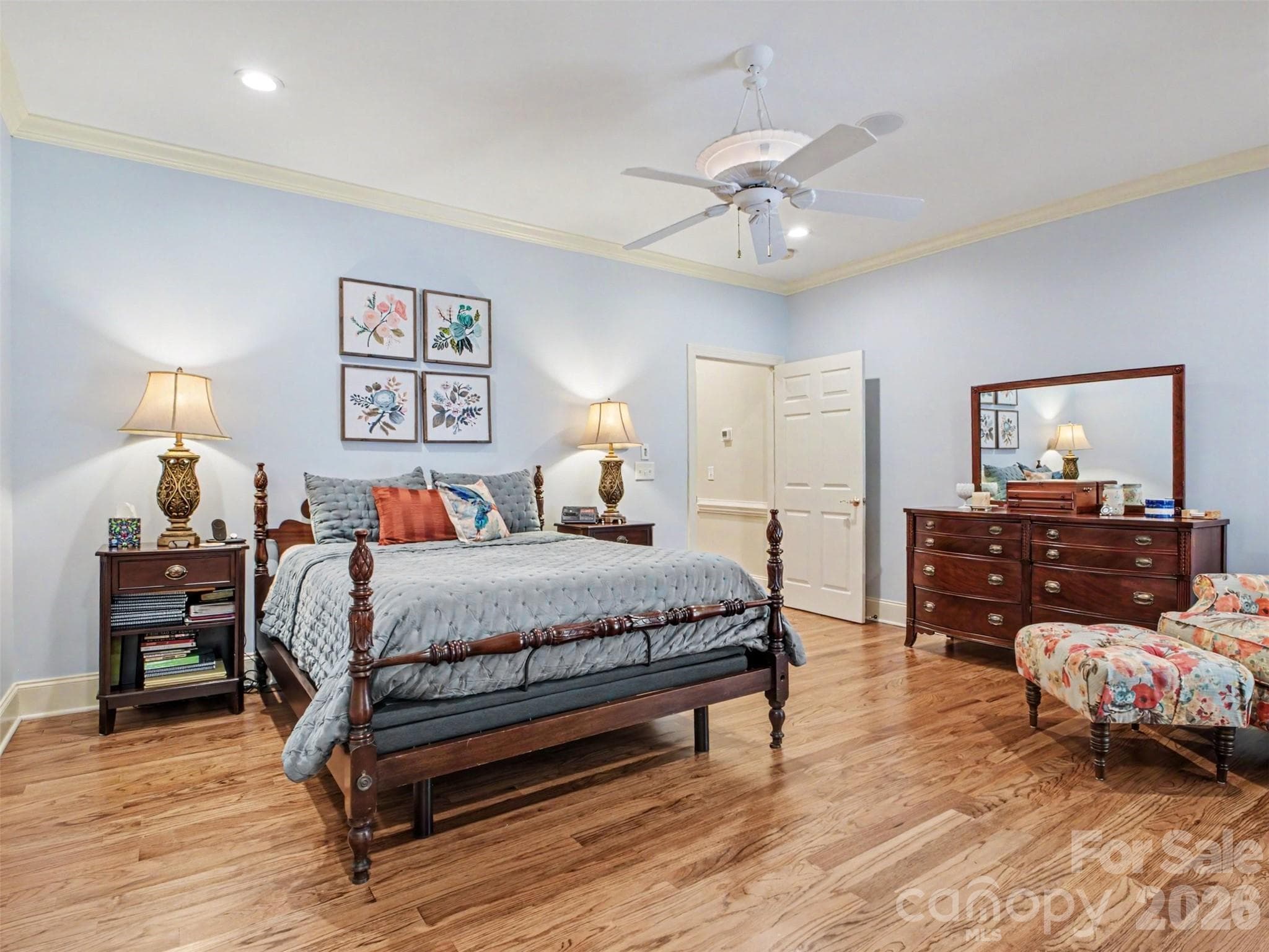 A modified split bedroom floor plan places this gorgeous primary bedroom on one side of the living areas along with a secondary bedroom nearby that can be used as nursery or guest room. - 1422 Stone Gate Drive, Shelby