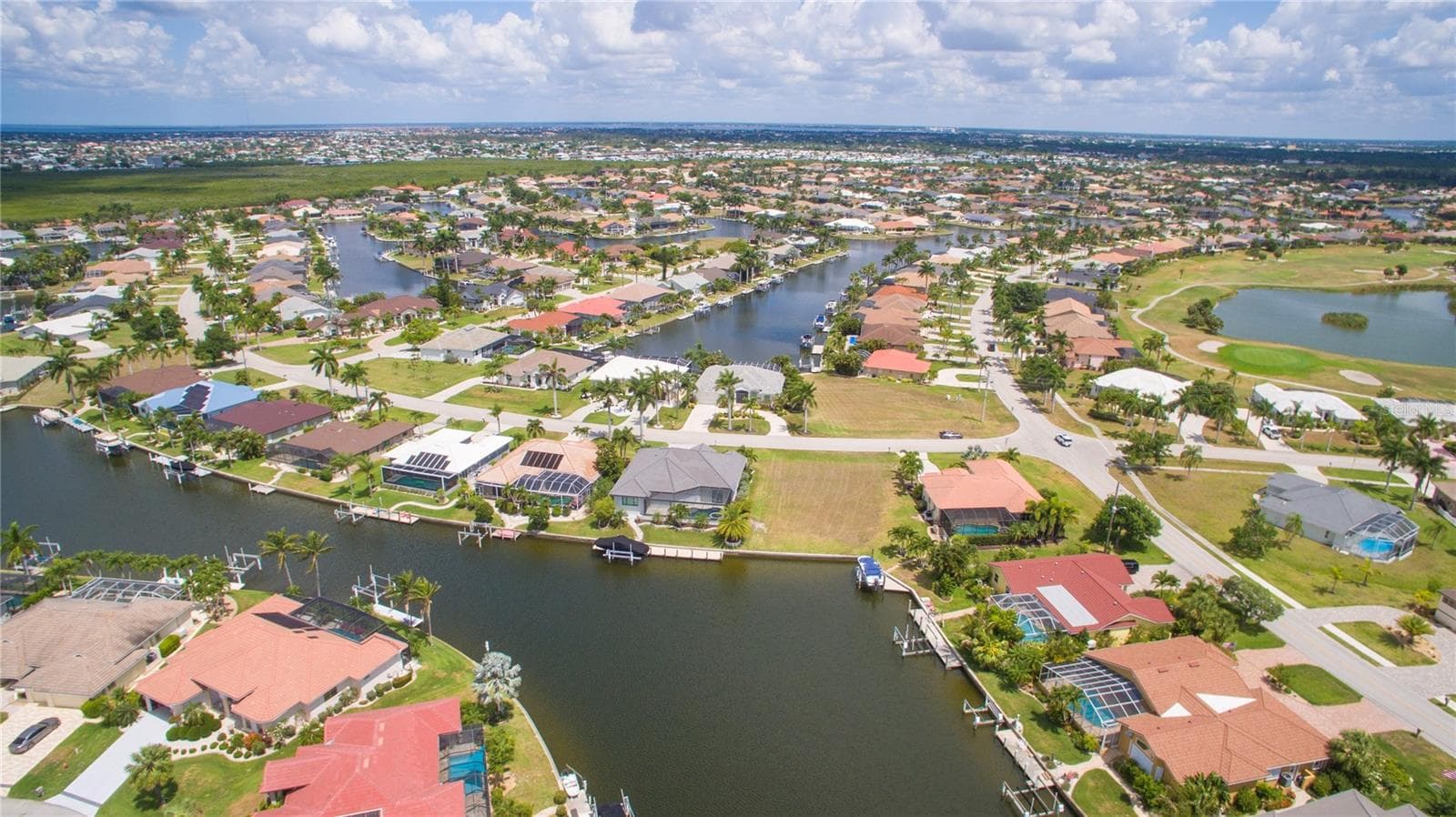 Rear view and looking northward towards Peace River and Charlotte Harbor - 507 MADRID BLVD, PUNTA GORDA