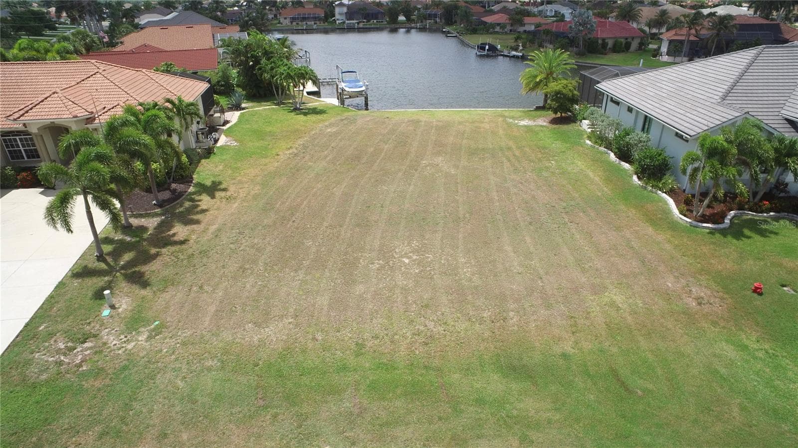 Aerial view of this residential, waterfront lot with seawall. - 507 MADRID BLVD, PUNTA GORDA