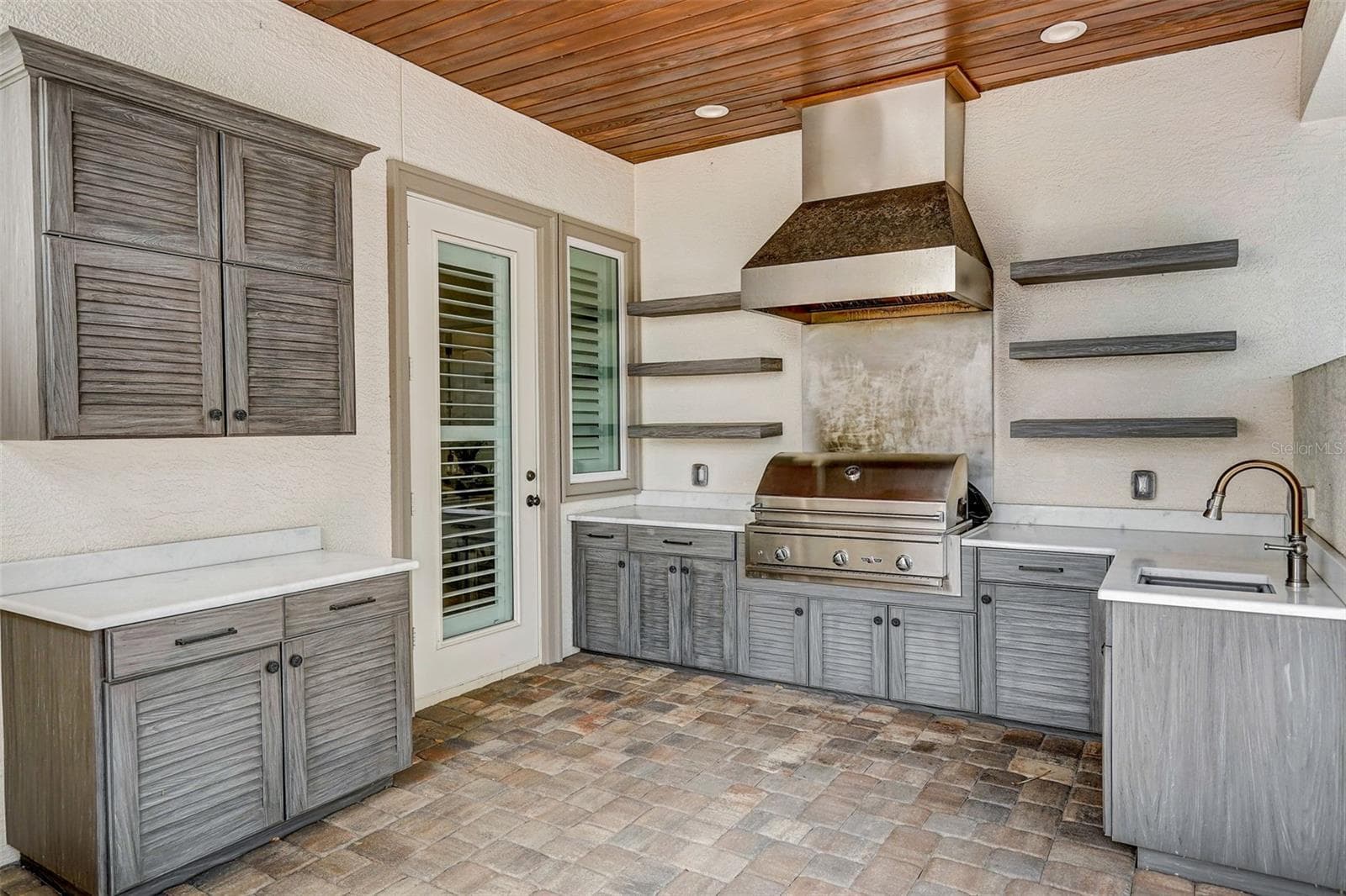 Outdoor grill area off kitchen - 125 S BLVD OF PRESIDENTS, SARASOTA
