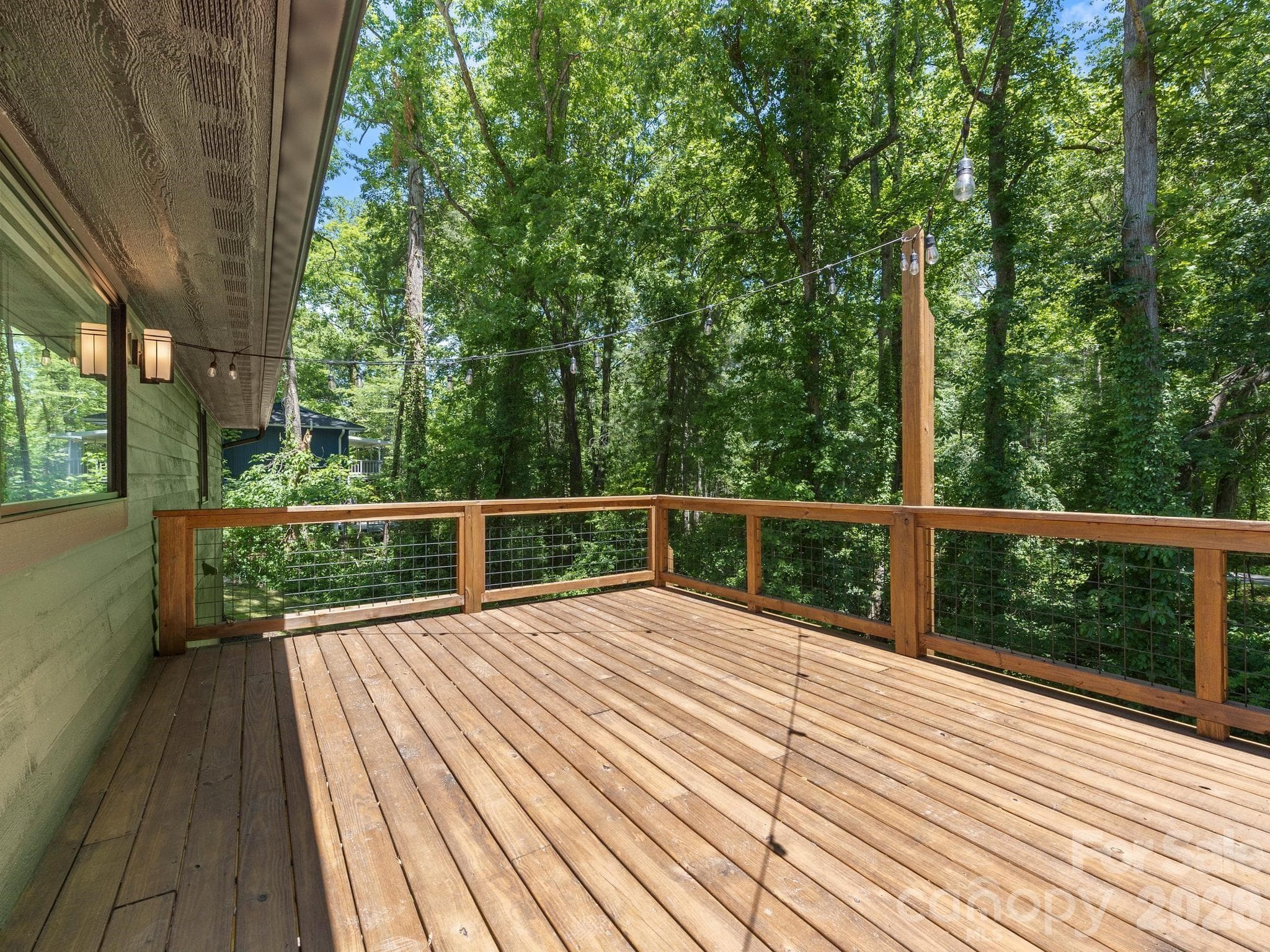 New stained back deck with party lights - 17 Muirfield Drive, Arden
