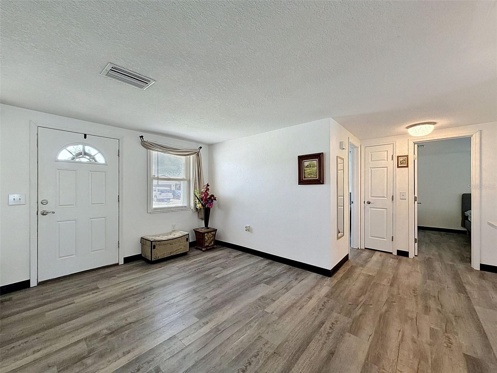 LUXUARY VINYL PLANK FLOORING - 12735 1ST ISLE, HUDSON