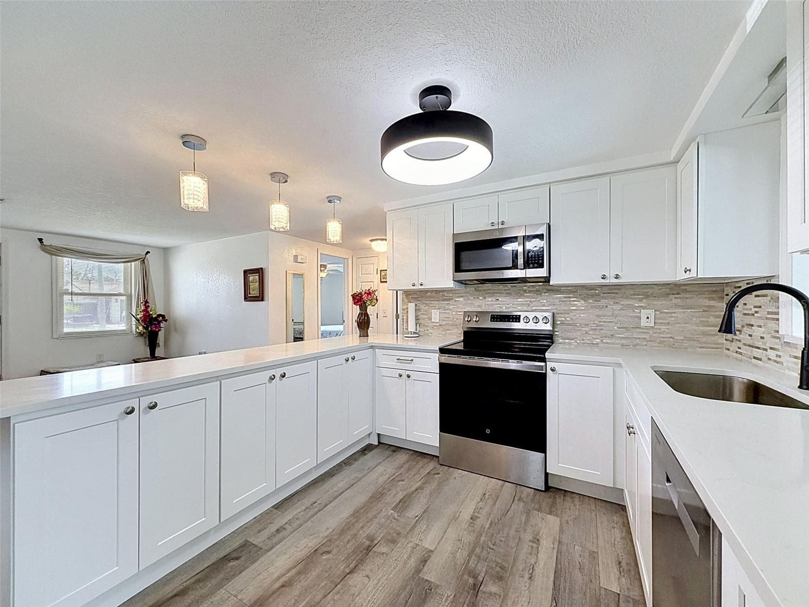 Beautiful stone countertops and updated finishes. - 12735 1ST ISLE, HUDSON