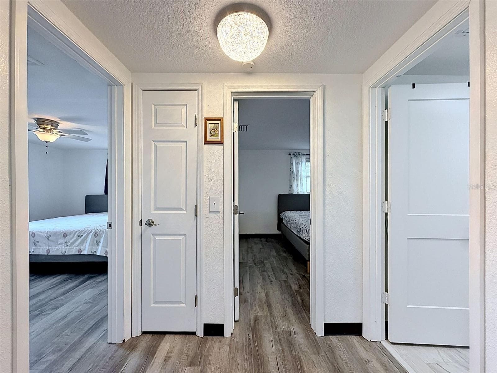 HALLWAY OFF KITCHEN TO BEDROOMS - 12735 1ST ISLE, HUDSON