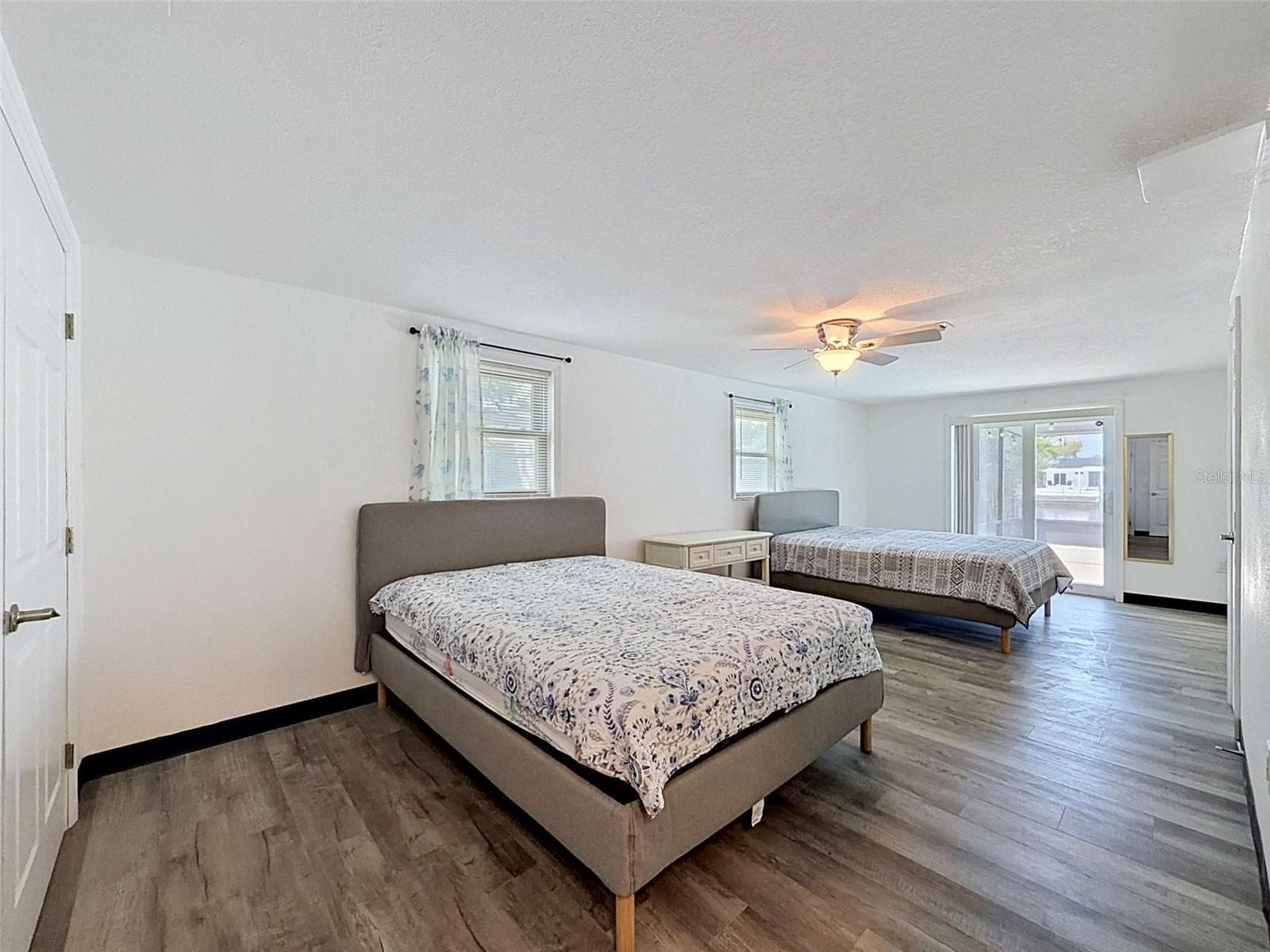 Spacious primary suite with room for multiple sleeping areas. - 12735 1ST ISLE, HUDSON