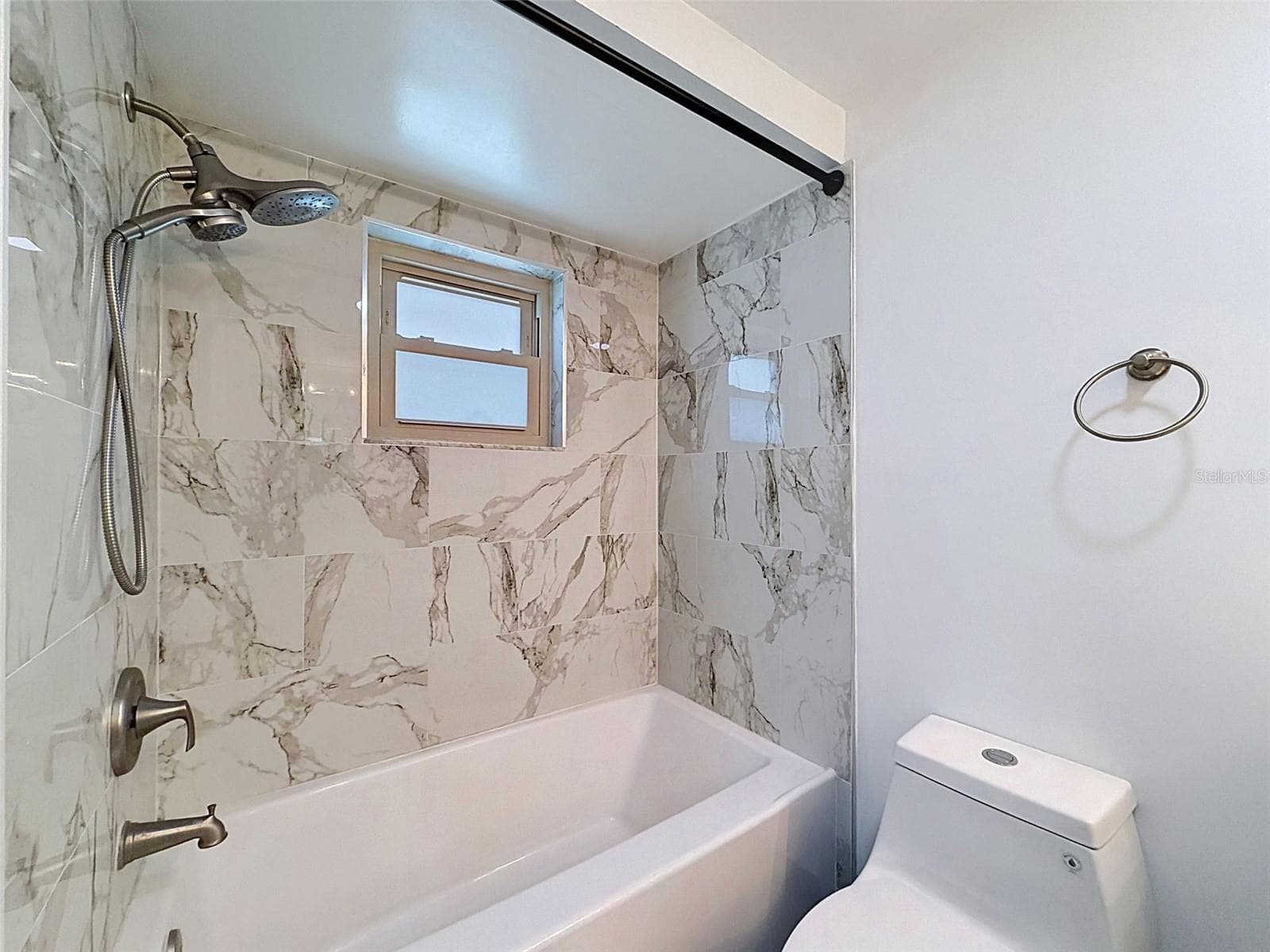 Beautiful tile work creates a spa-like shower experience. - 12735 1ST ISLE, HUDSON