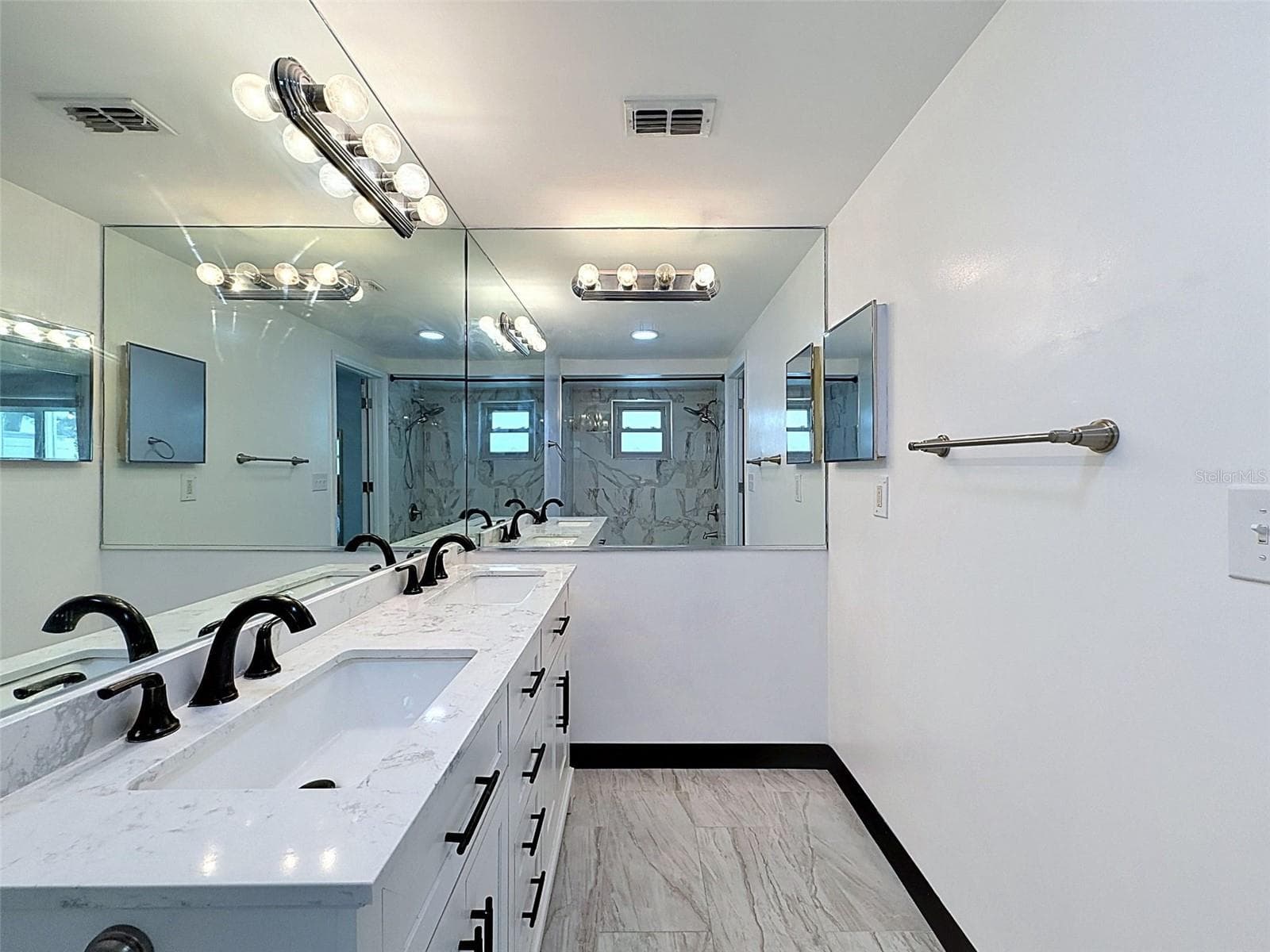Spacious primary bathroom with double vanity. - 12735 1ST ISLE, HUDSON