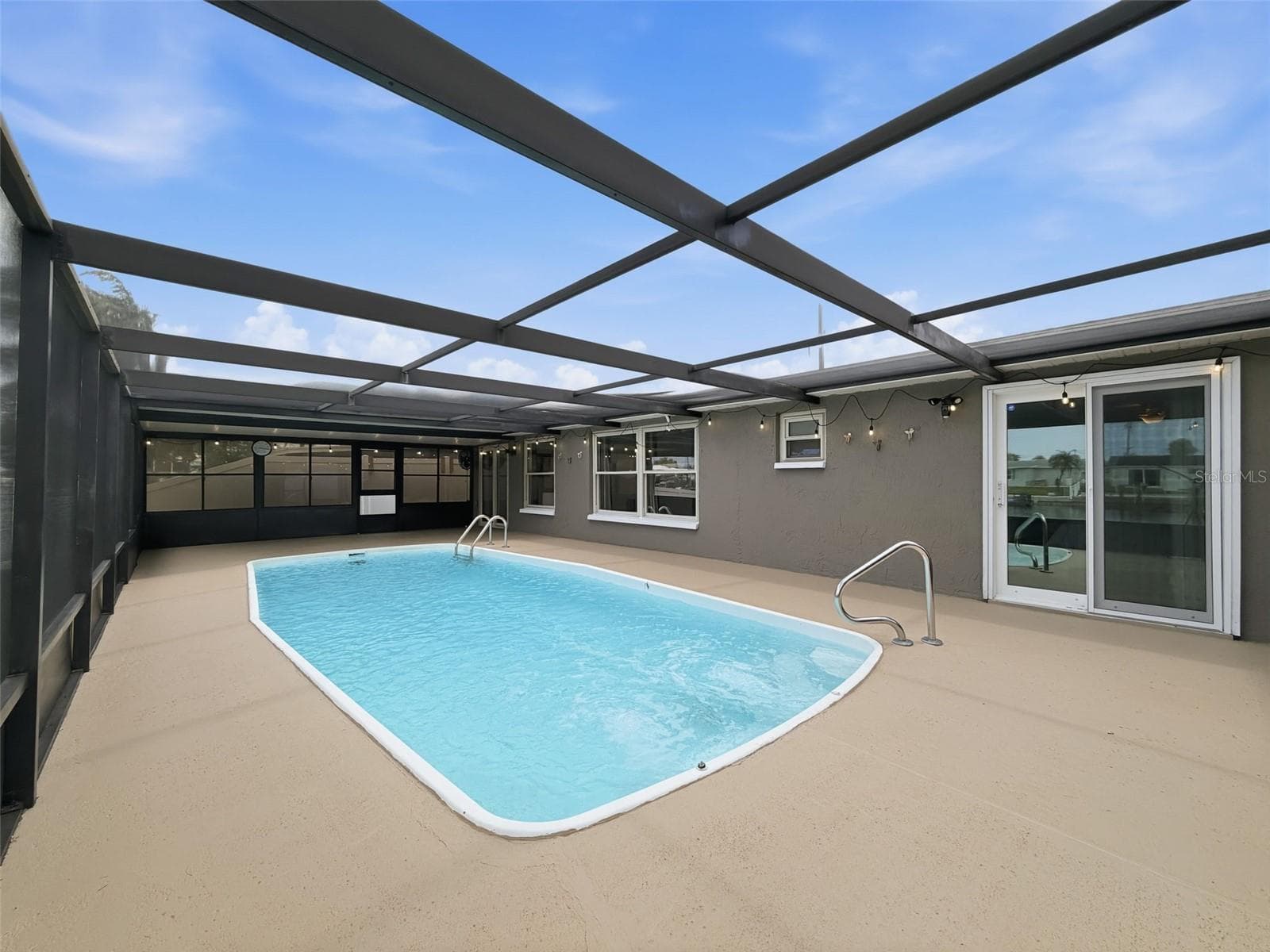 Enjoy waterfront breezes from the comfort of your screened lanai. - 12735 1ST ISLE, HUDSON