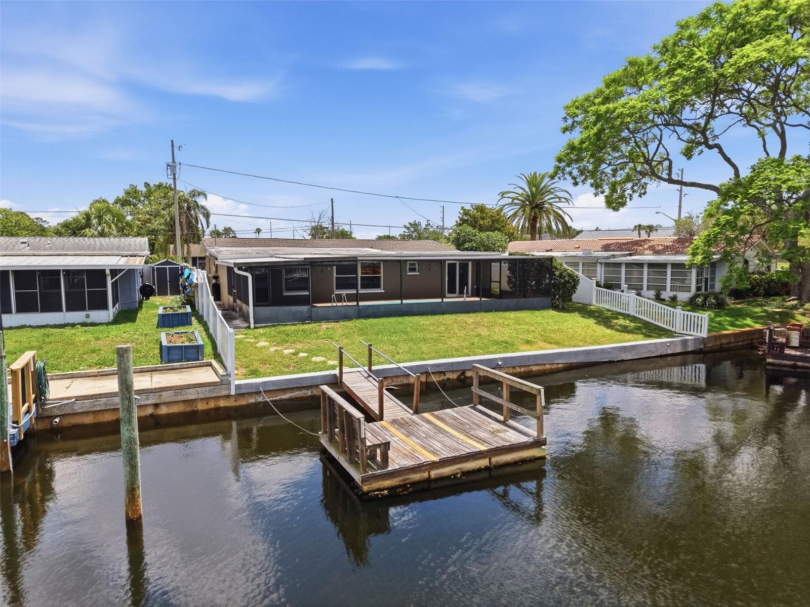 Aerial view of the floating dock and waterfront setting. - 12735 1ST ISLE, HUDSON